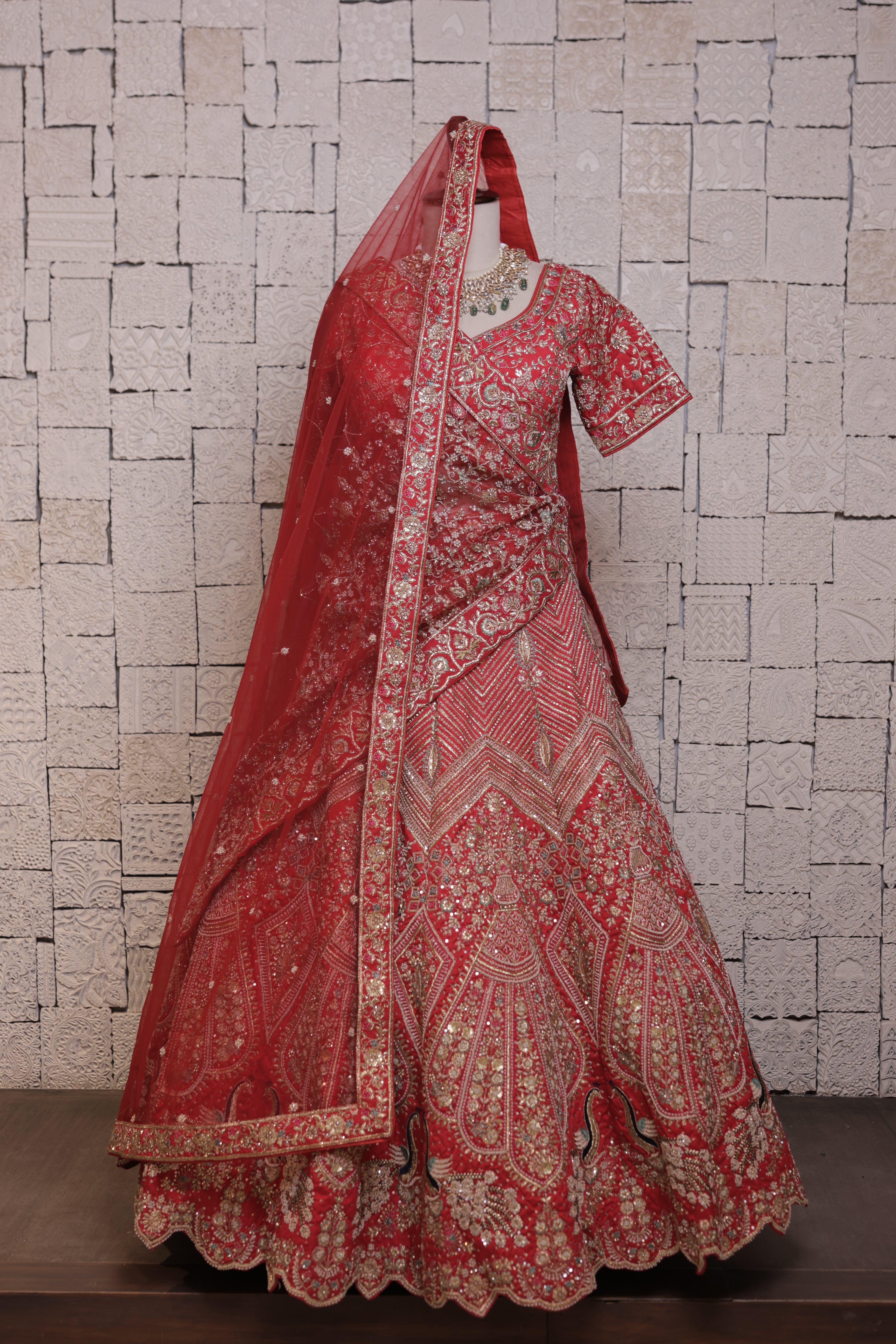 Red bridal lehenga with Urn & peacock embroidery design
