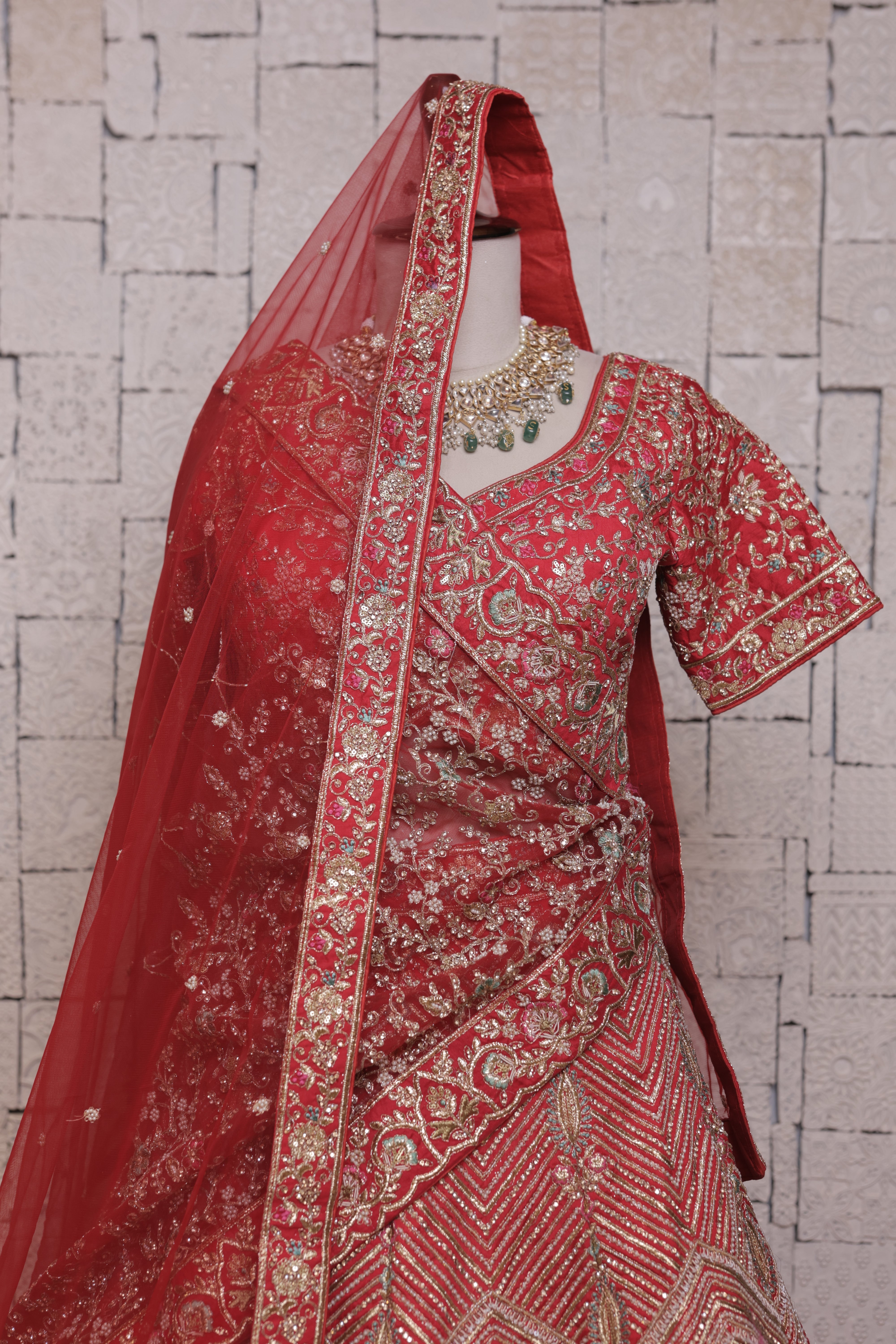 Red bridal lehenga with Urn & peacock embroidery design