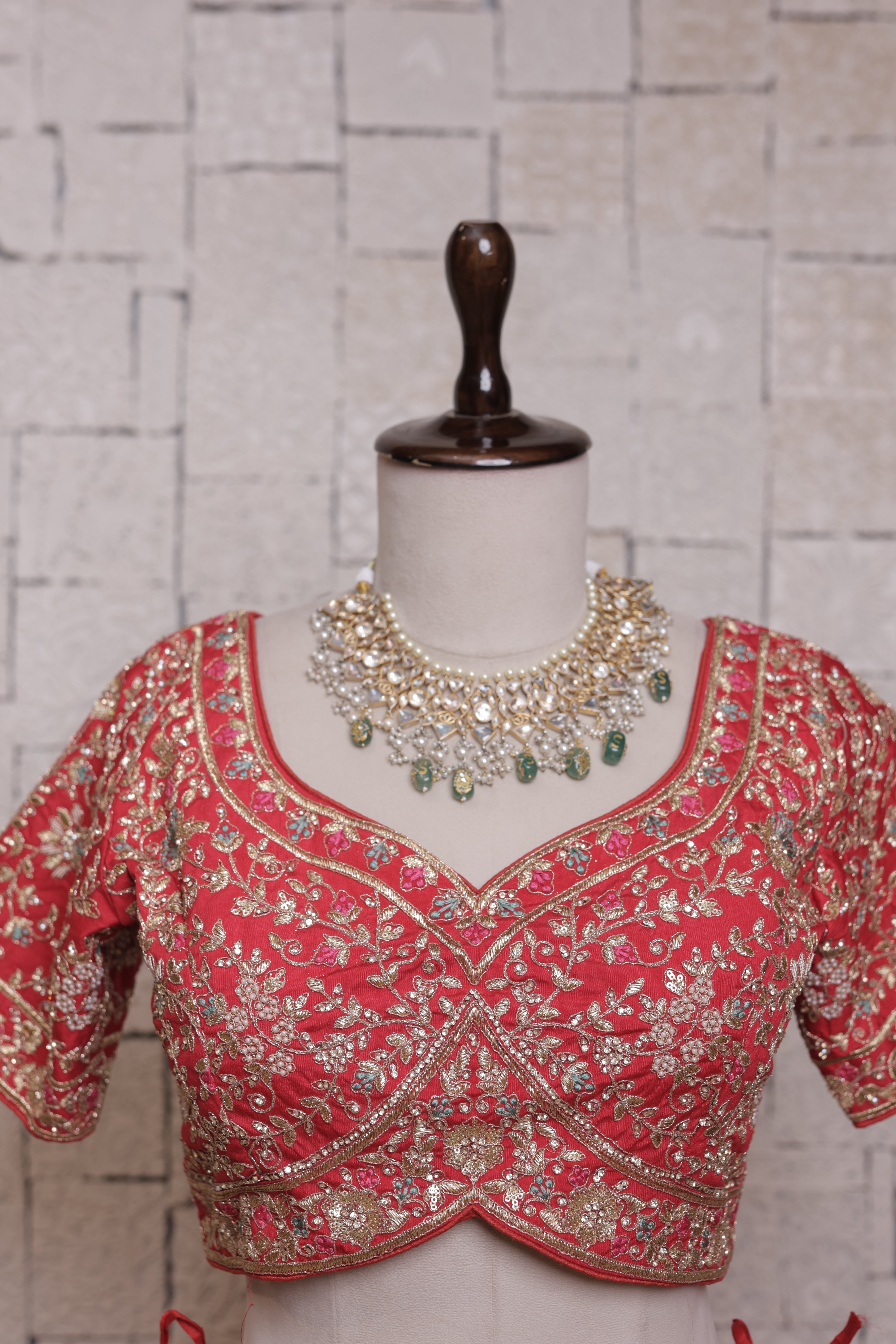 Red bridal lehenga with Urn & peacock embroidery design