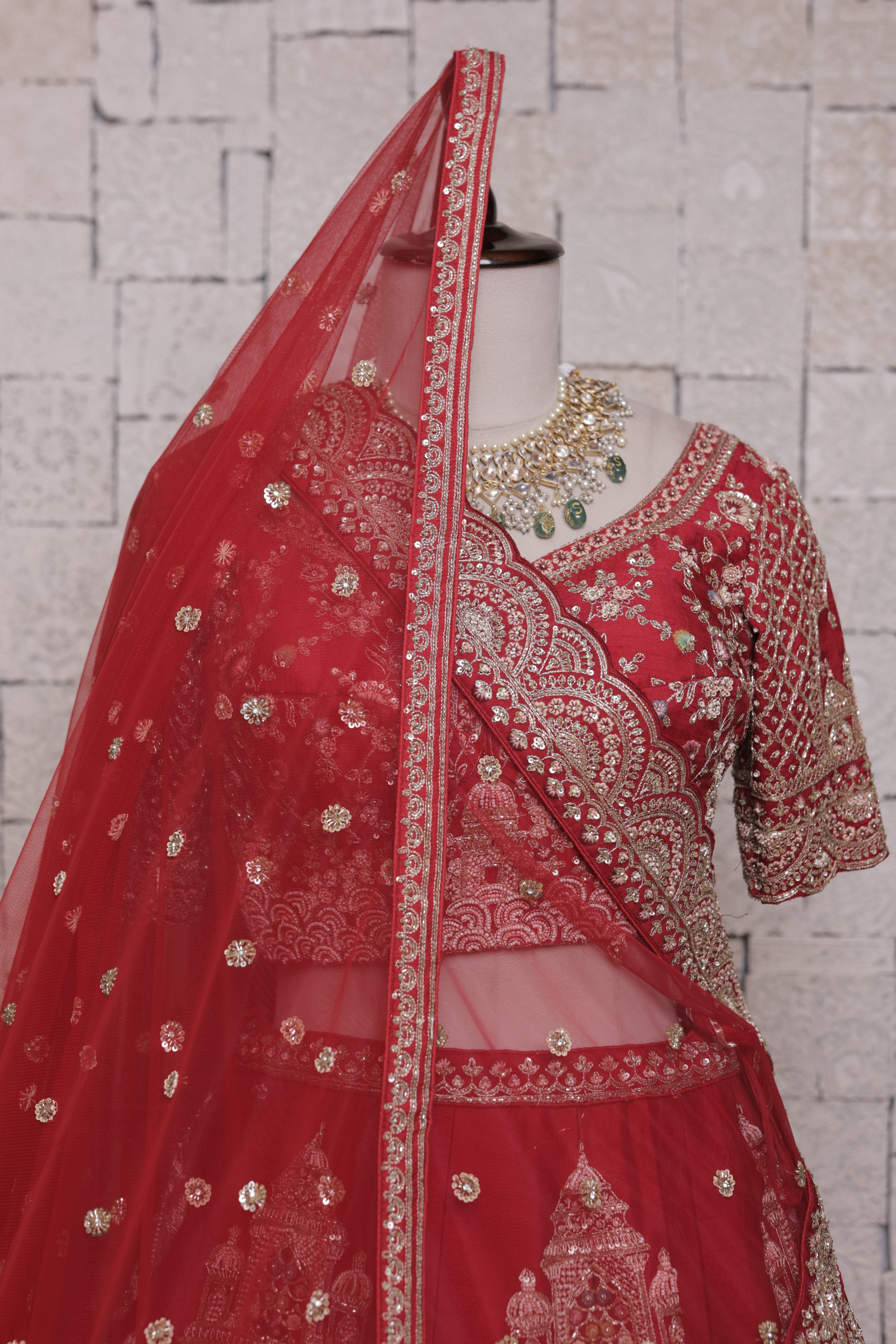 Red Multilayered Bridal Lehenga with Temple Embroidery