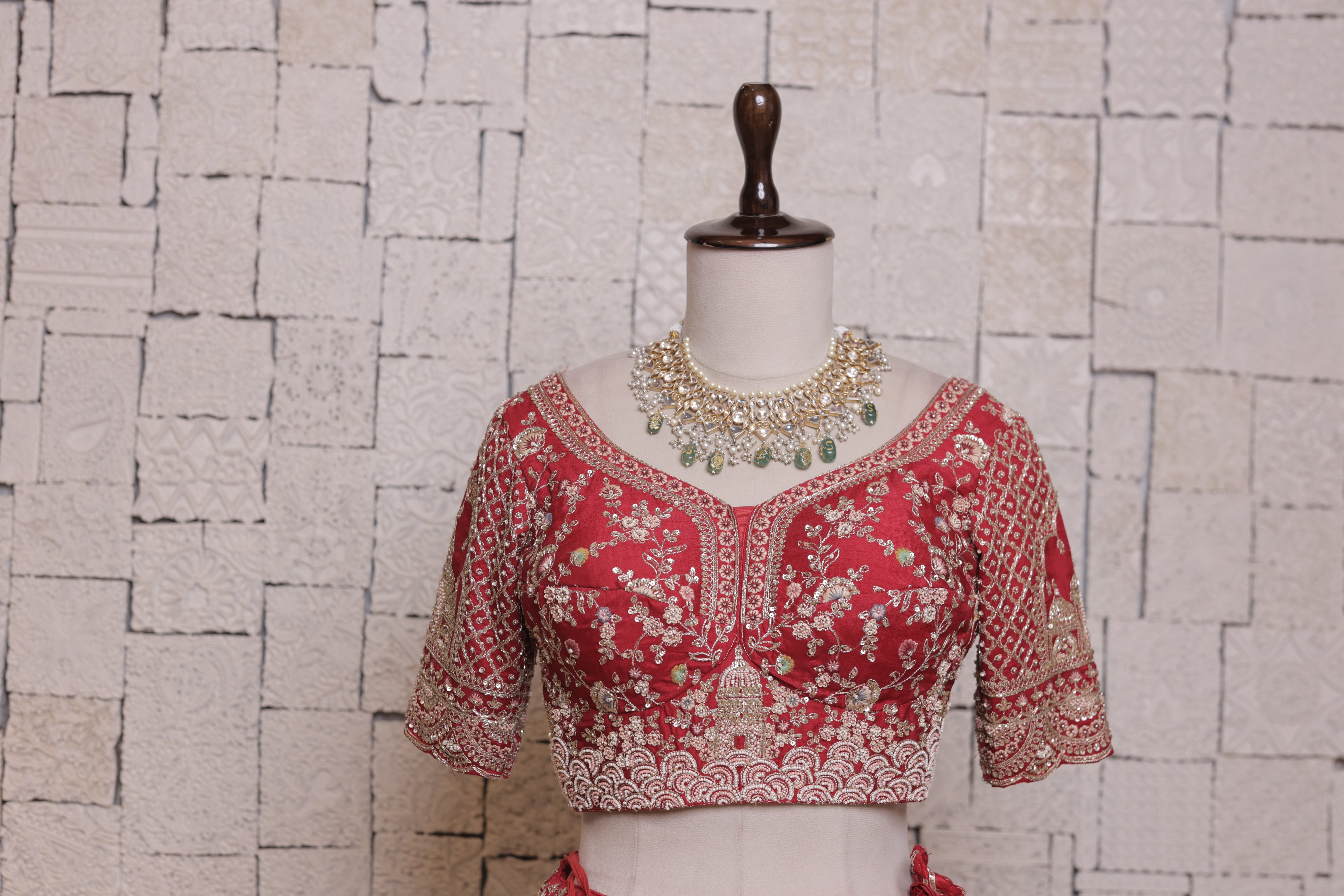 Red Multilayered Bridal Lehenga with Temple Embroidery