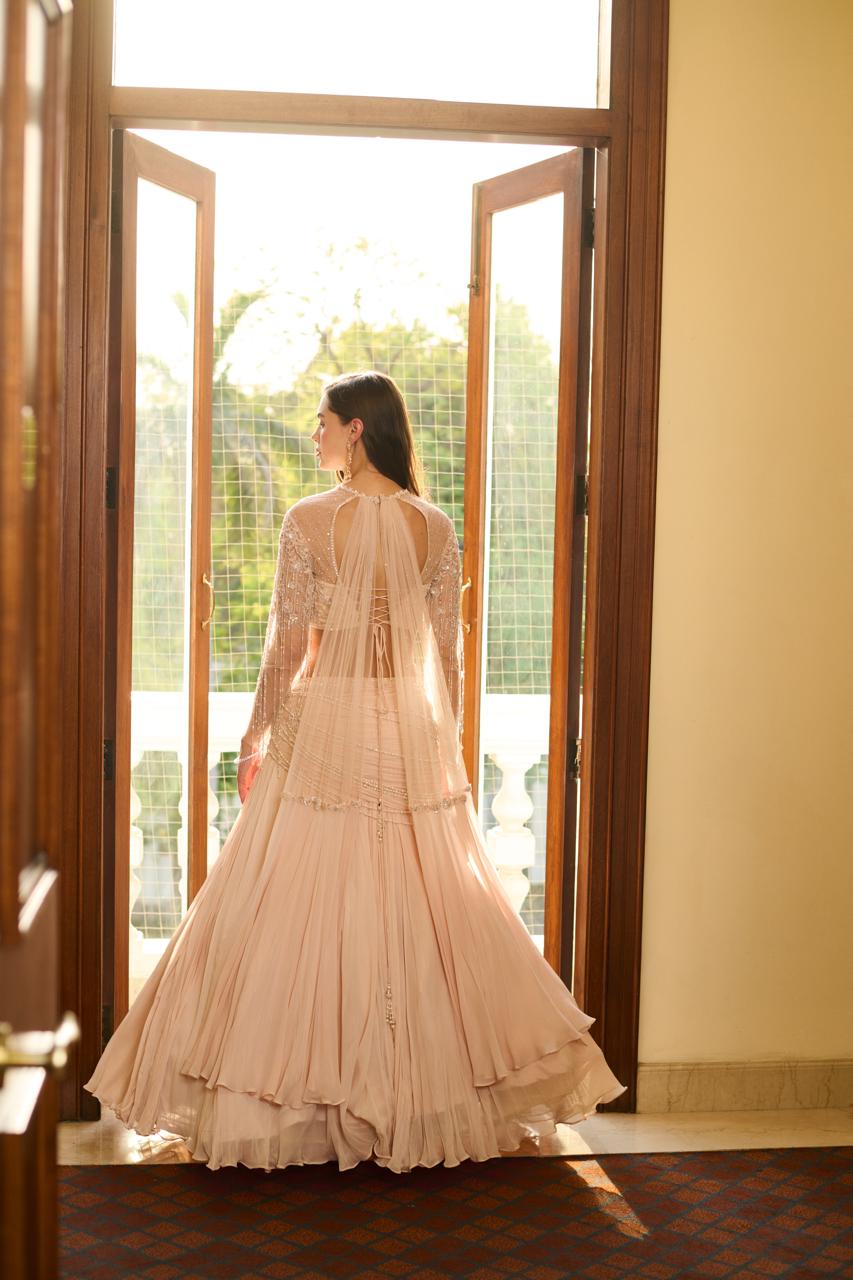 Pastel pink net lehenga with sequins and pearl detailing