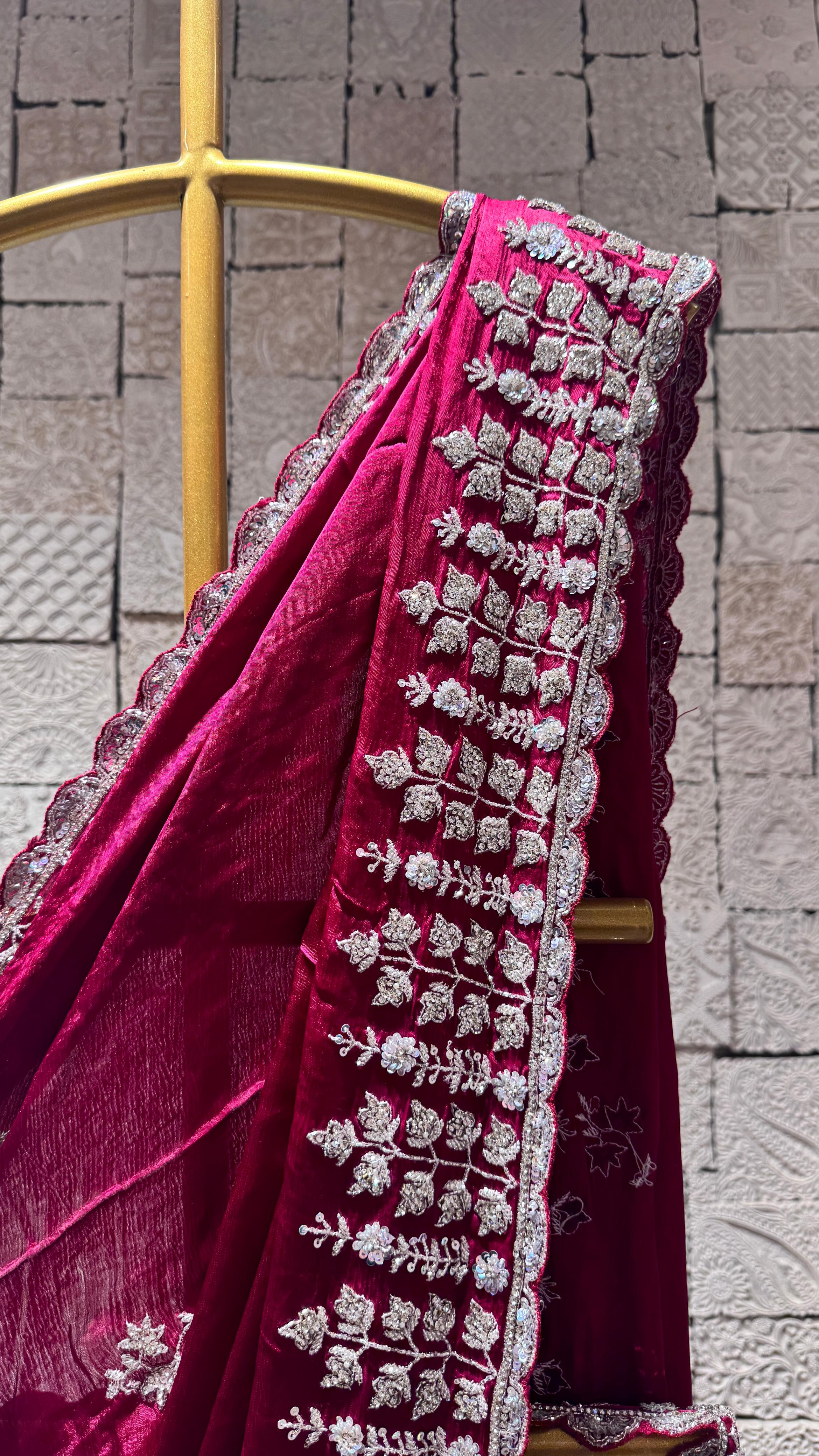 Deep pink saree with heavy floral border