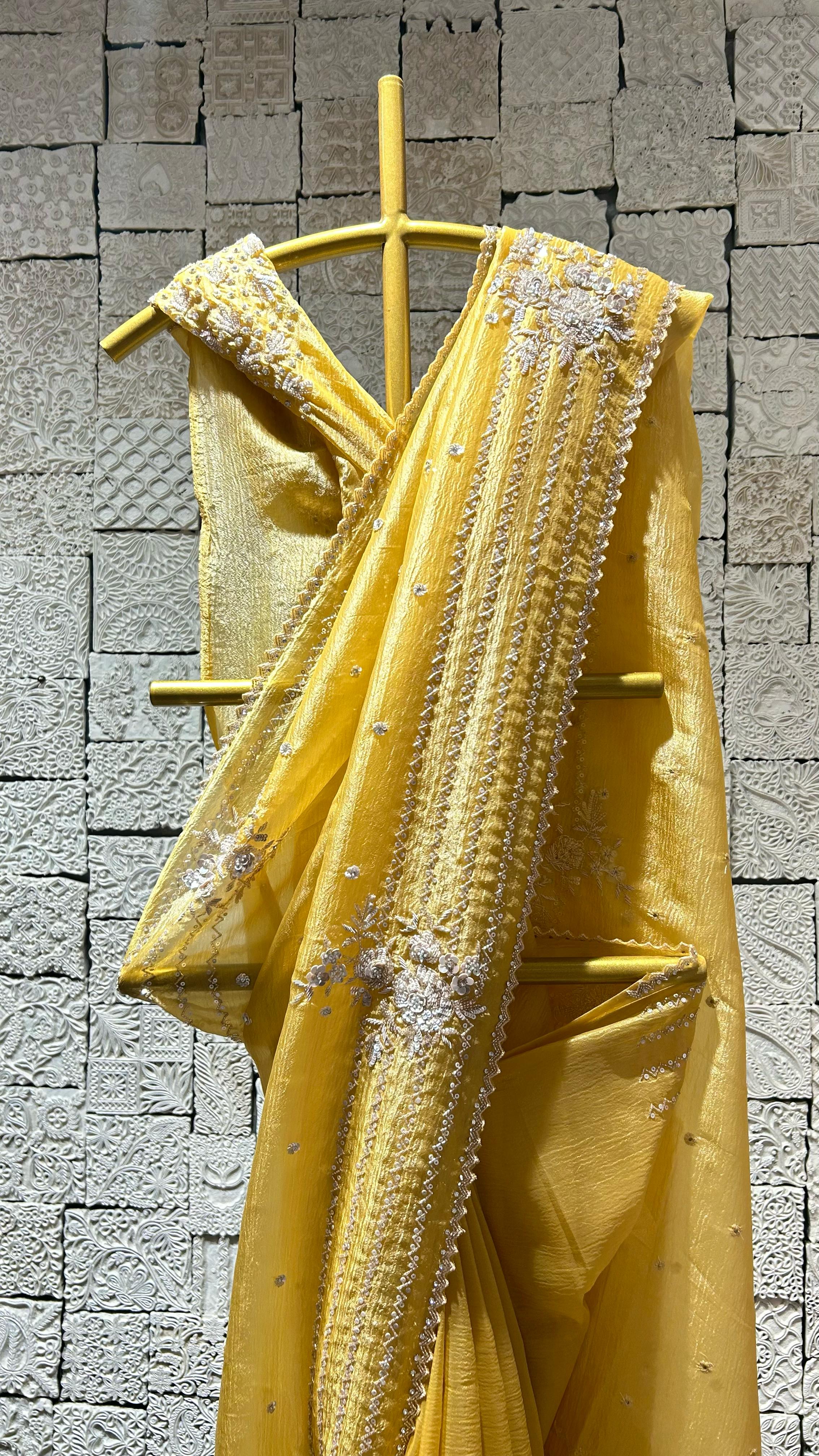 Yellow saree with simple zig-zag border