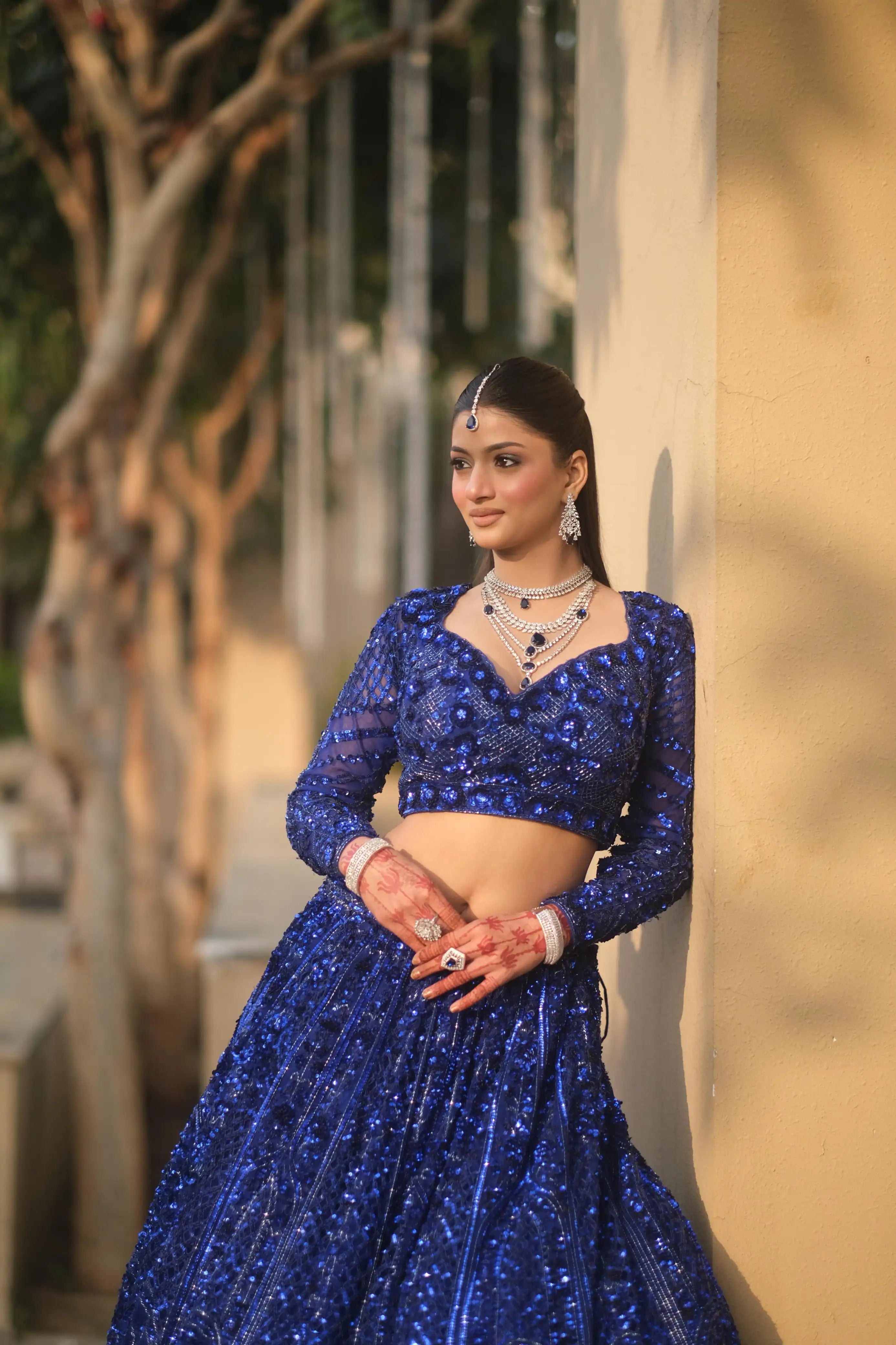 Royal blue net lehenga with floral embellishments