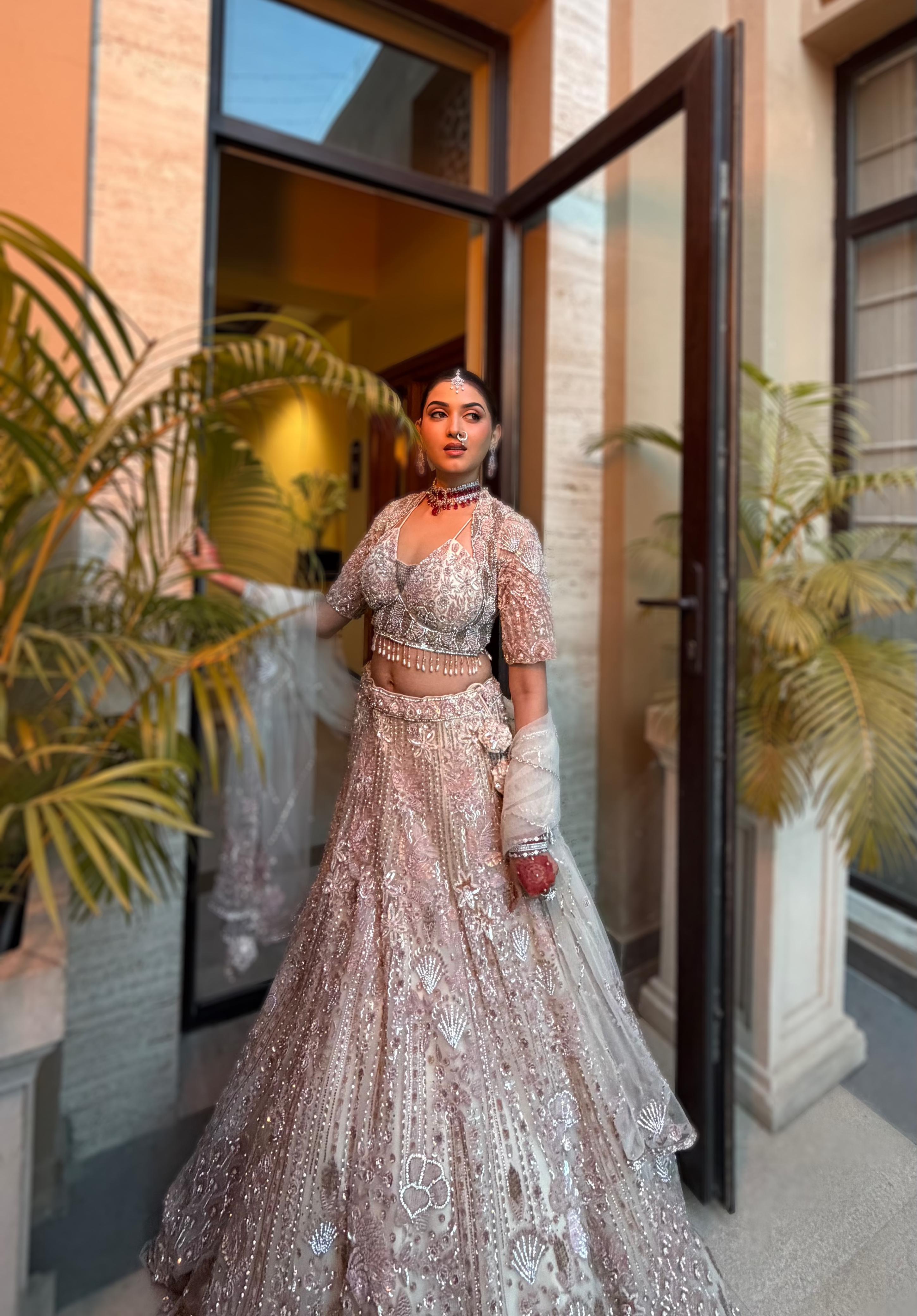 Pink & cream net lehenga with Floral embellishments