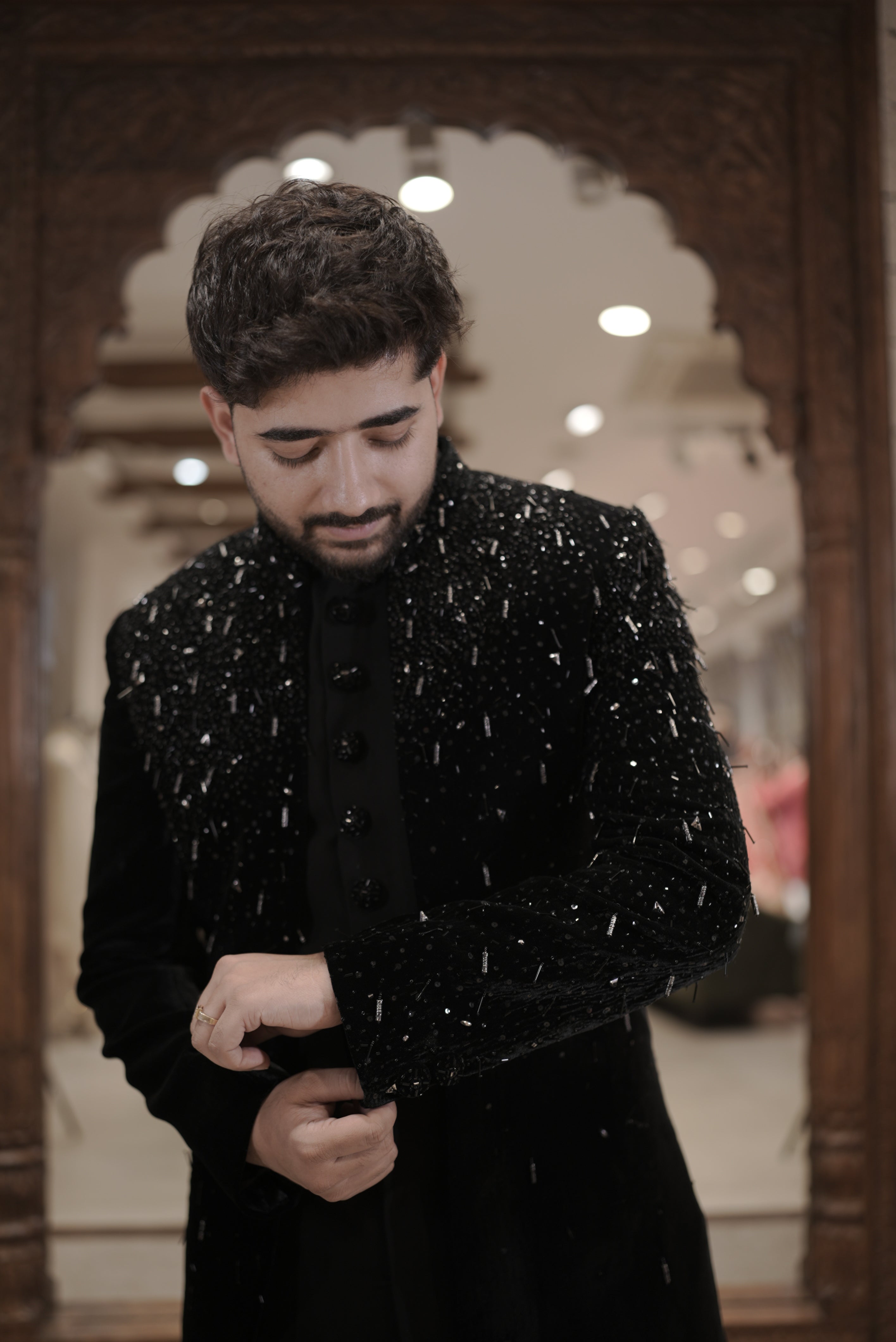 Black velvet indo-western sherwani with sequin embellishments