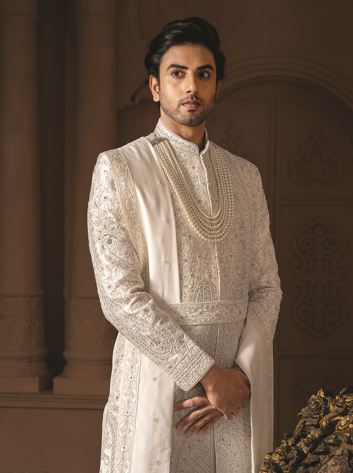 Ivory silk sherwani with silver heavy embroidery and waist belt (accessories included)