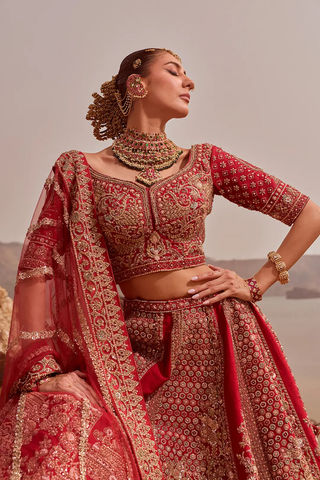 Classic red bridal lehenga with all over zari and thread work