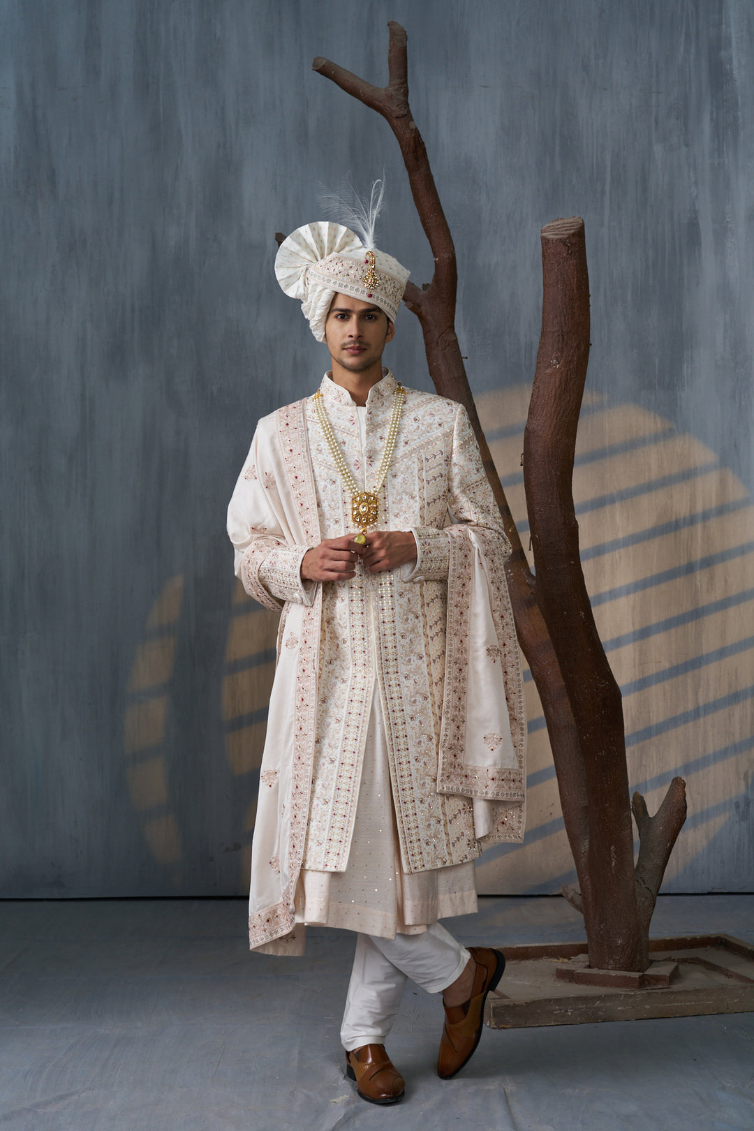Cream silk sherwani set with embellishments