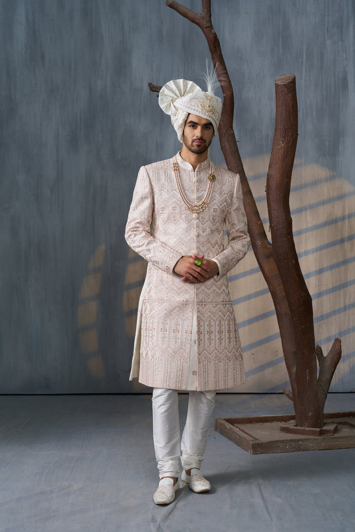 Cream silk sherwani set with contrasting embellishments (accessories included)