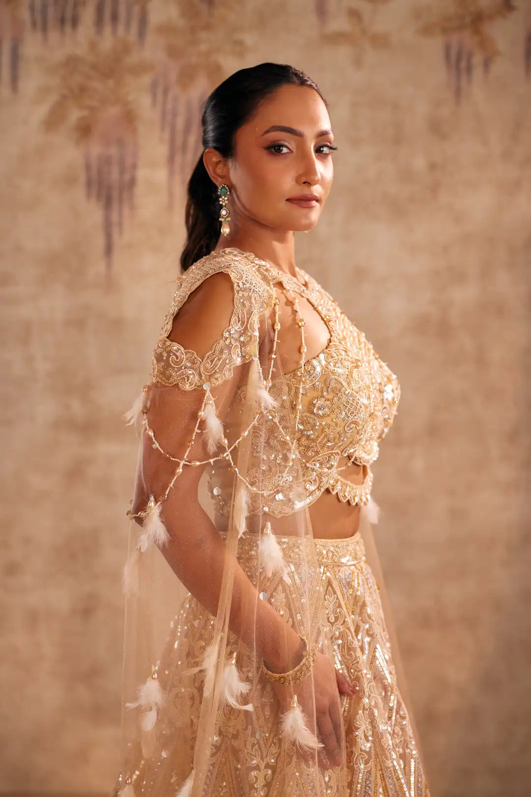 Cream Lehenga with Choker Style Cape and Embroidery