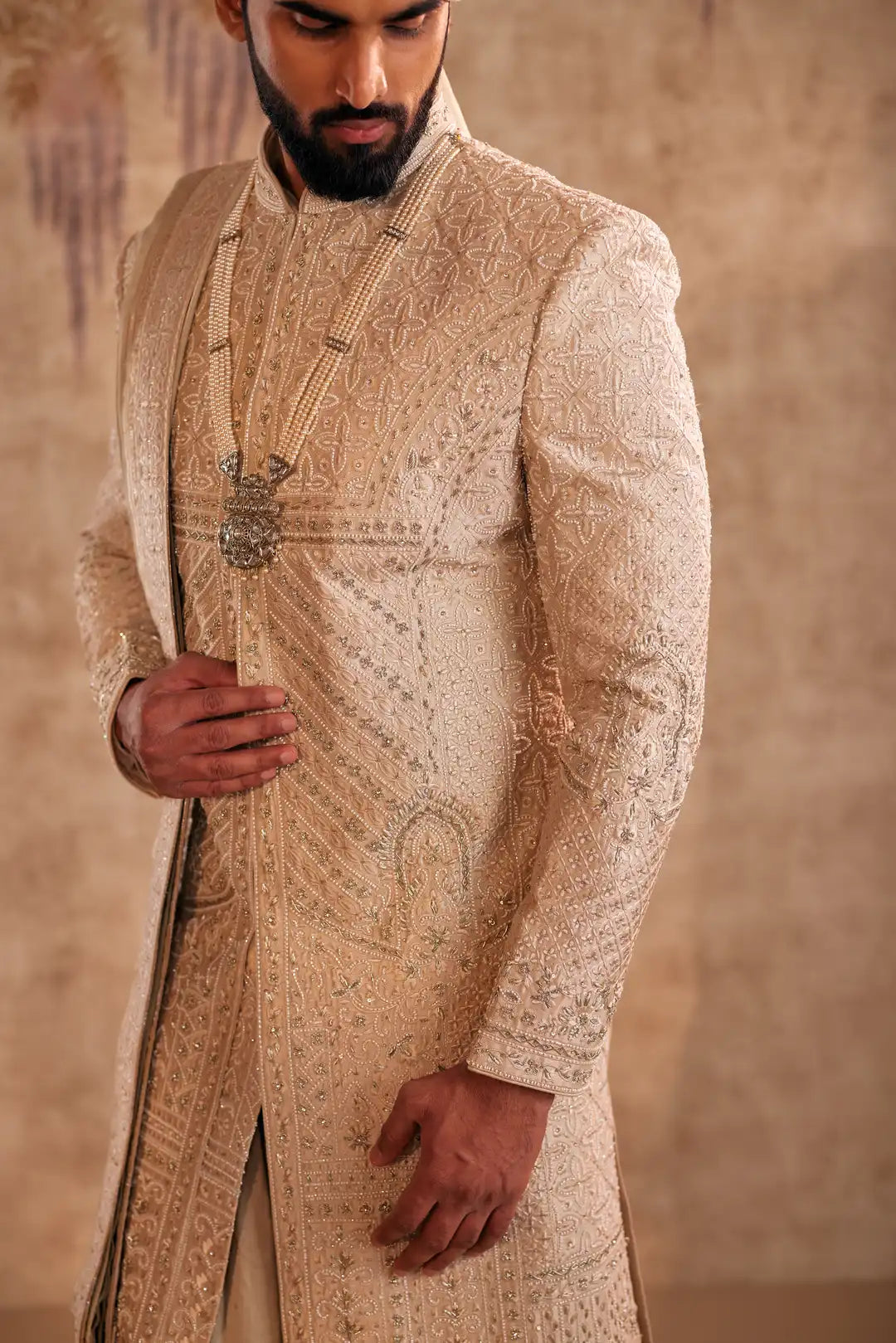 Gold Sherwani set with zardozi and Butti work