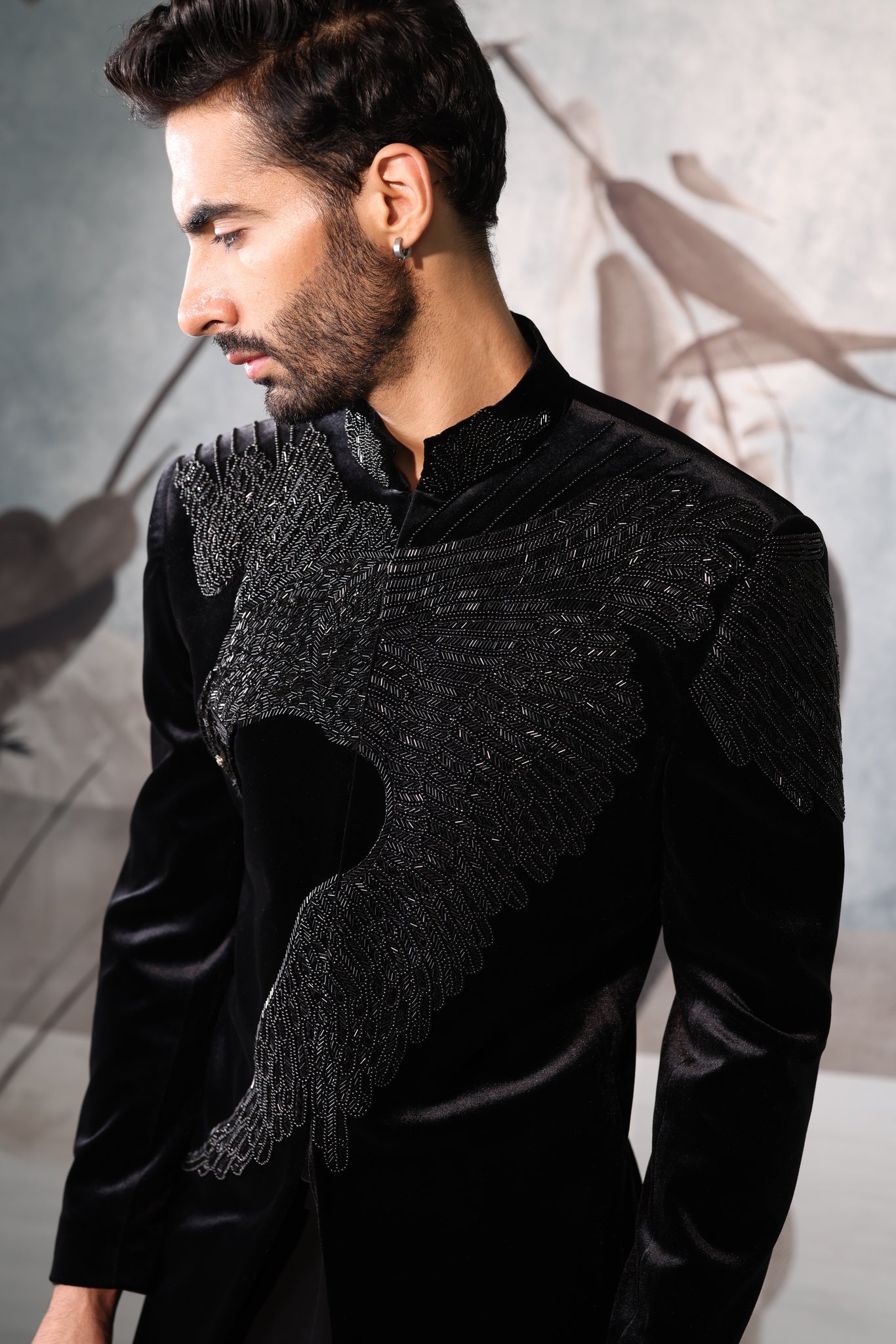 Man wearing a black Bandgala against a neutral background