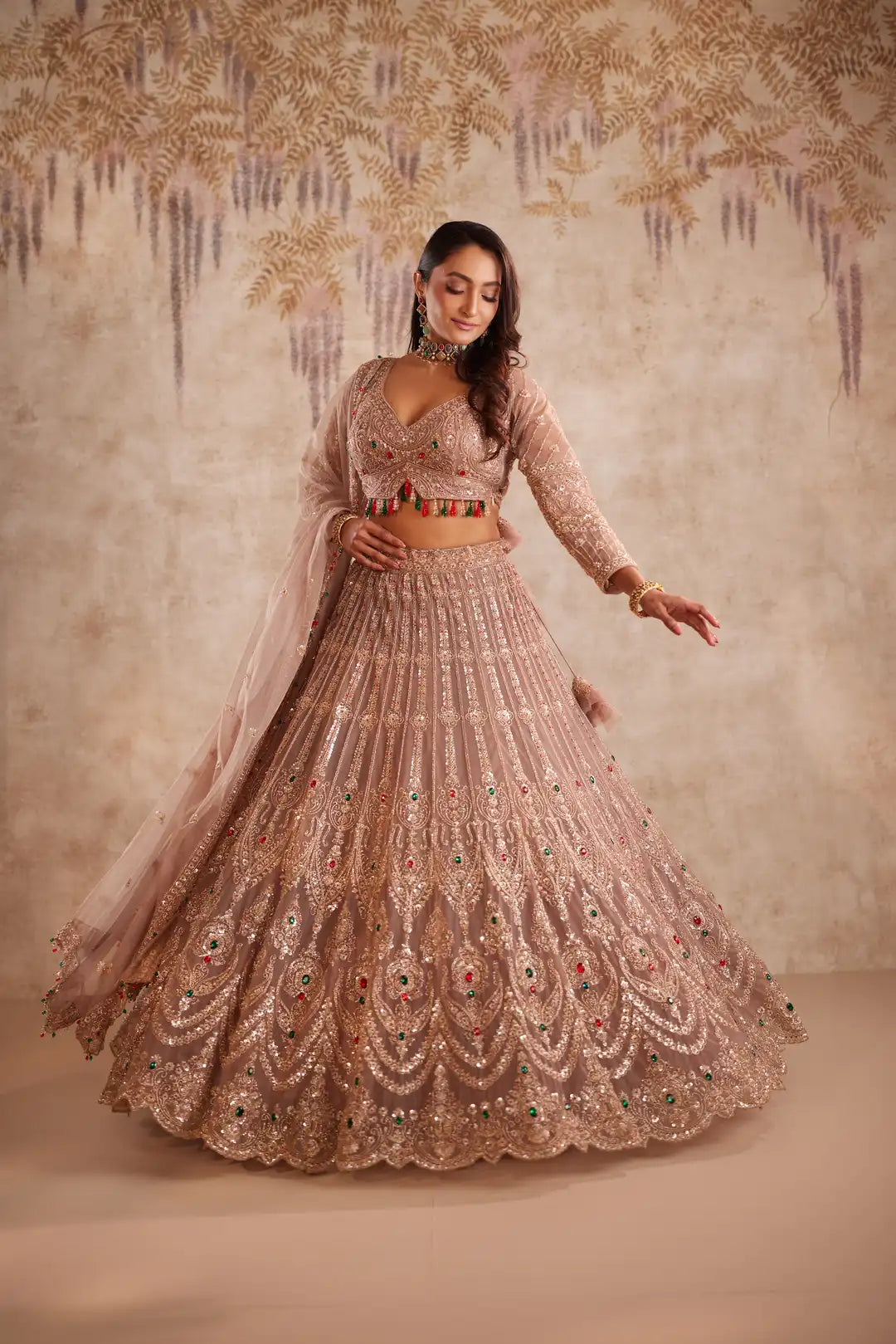Mauve net lehenga with multi color beadwork
