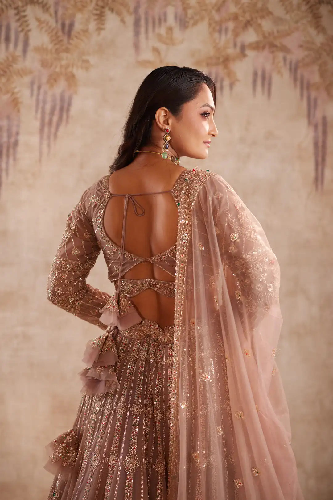 Mauve net lehenga with multi color beadwork