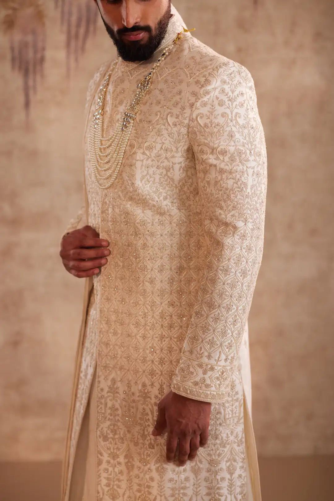 Ivory Sherwani suit with beads and zari work