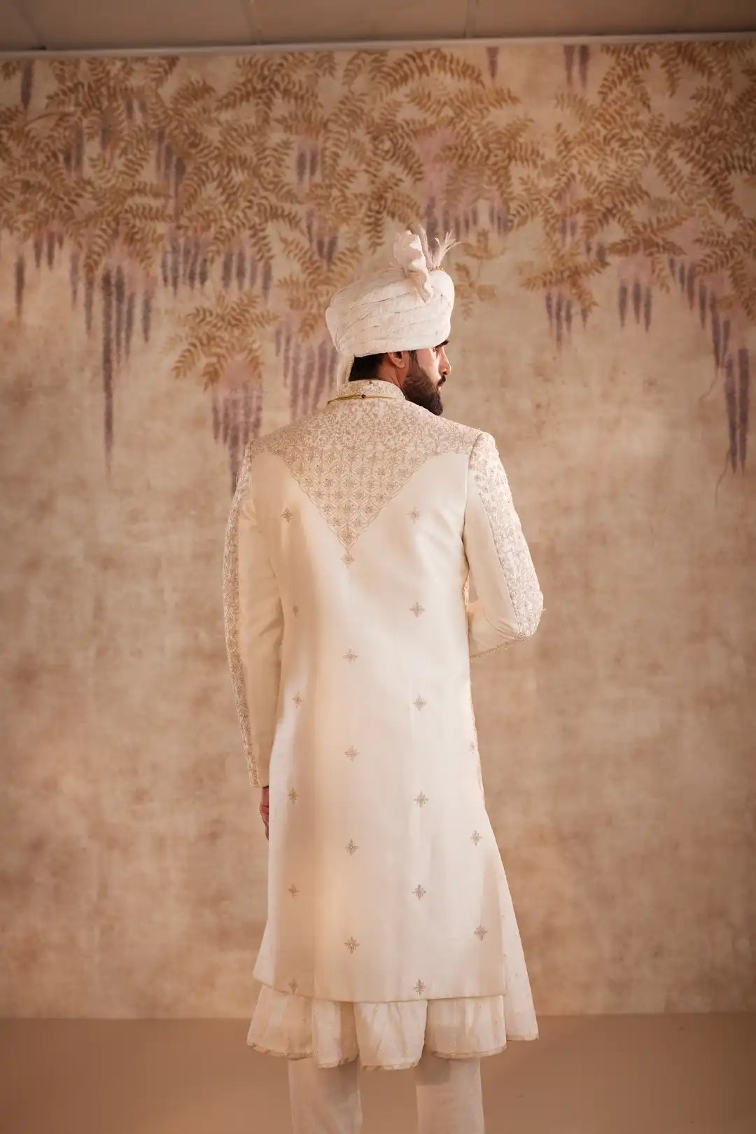 Ivory Sherwani suit with beads and zari work