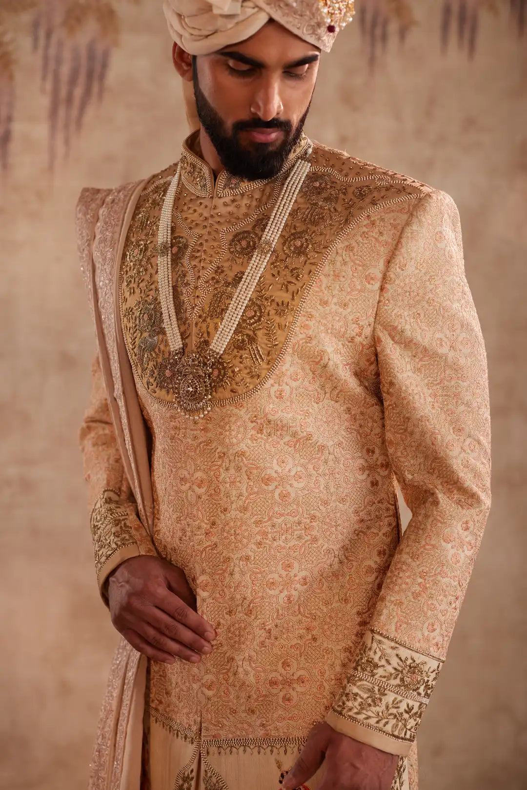 Gold silk Sherwani for groom with intricate hand embroidery