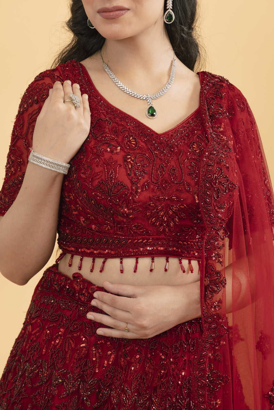 Red net lehenga with sequins embroidery