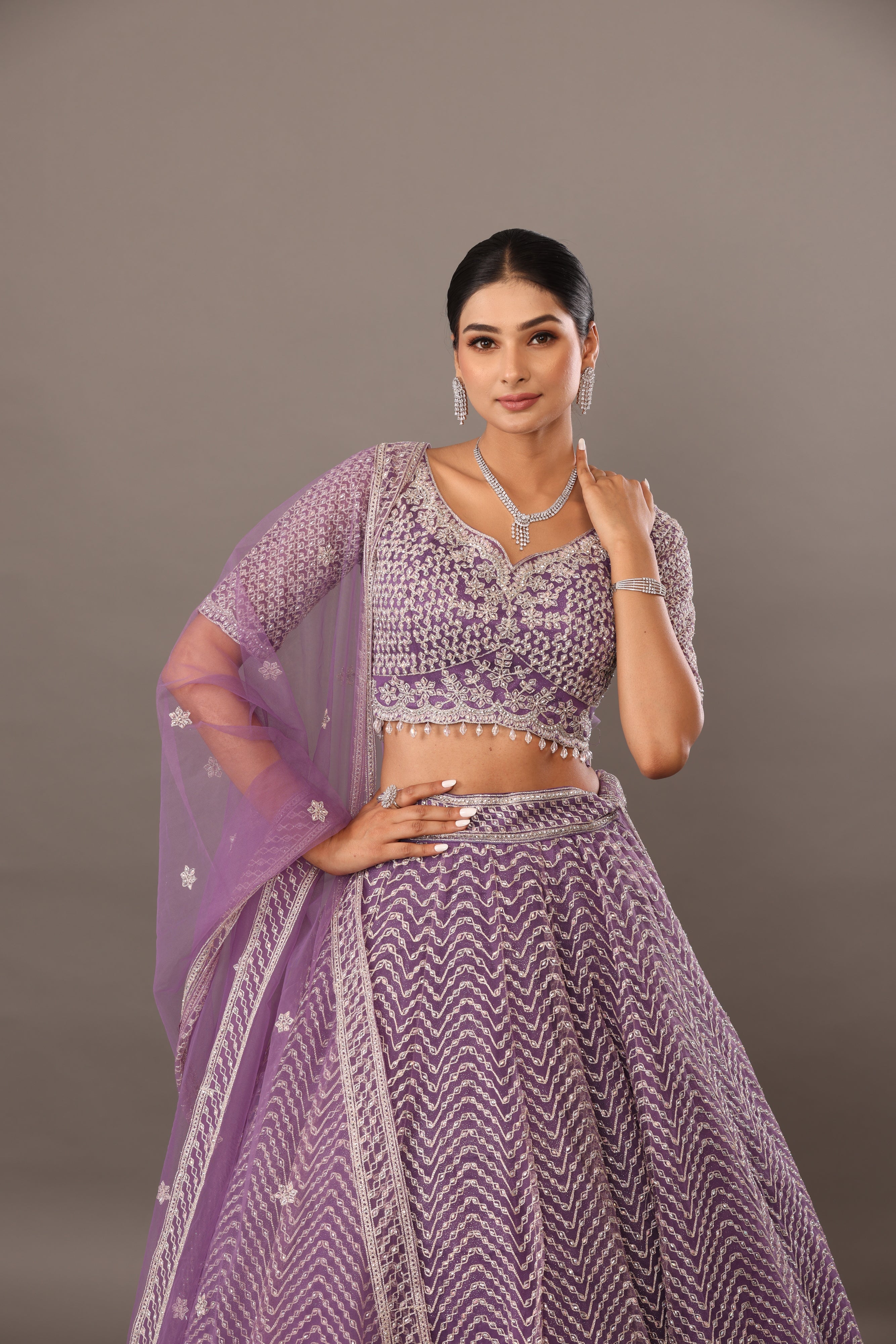 Lilac net base lehenga with embellishments