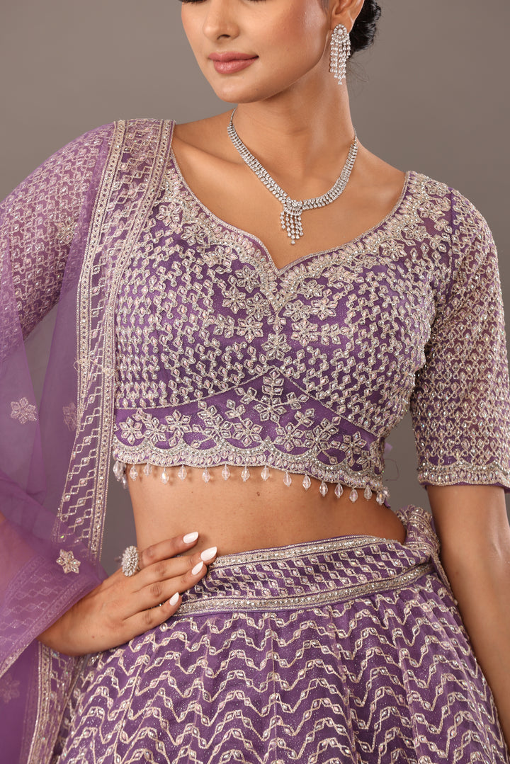 Lilac net base lehenga with embellishments