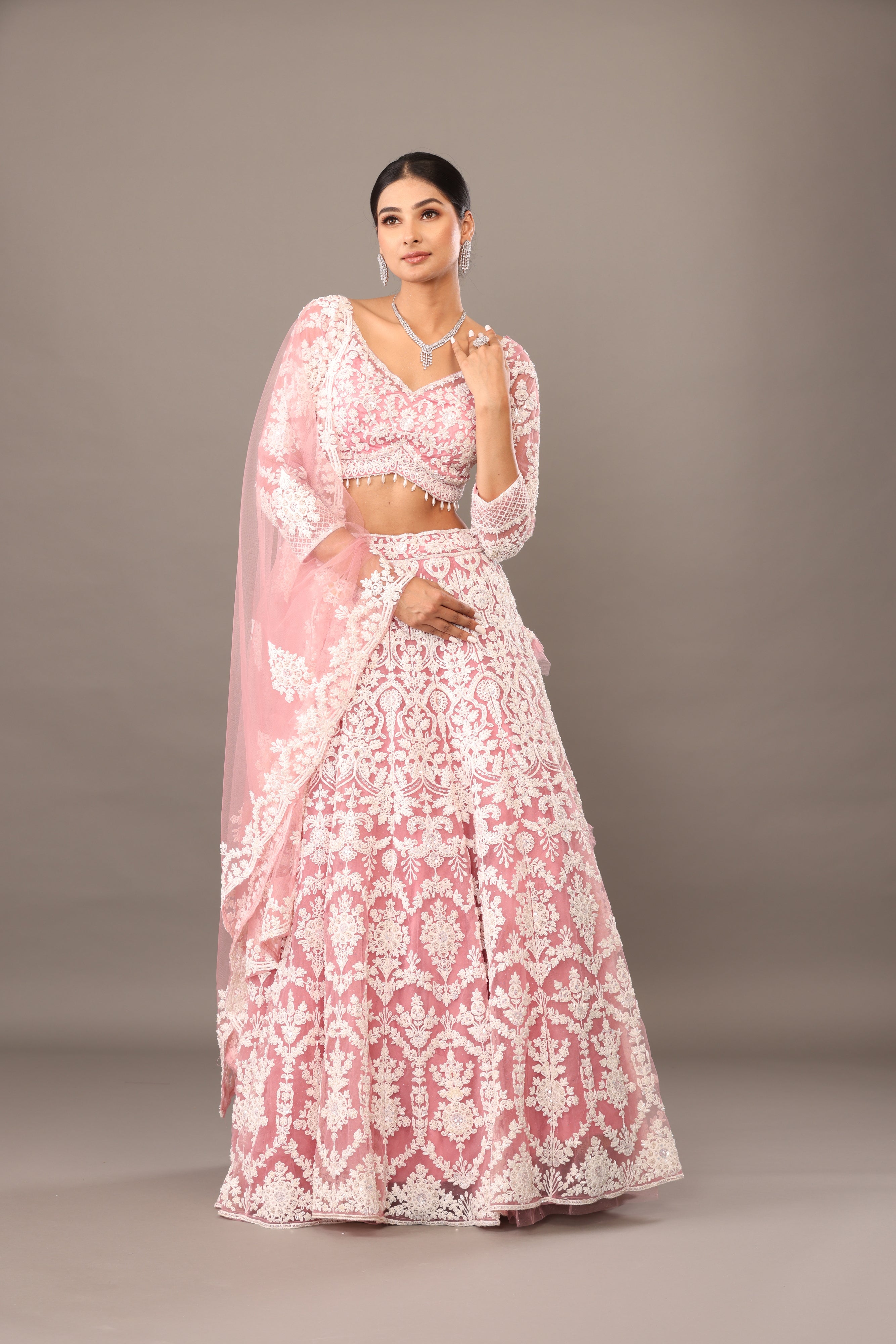 Pink net lehenga with pearl embellishments