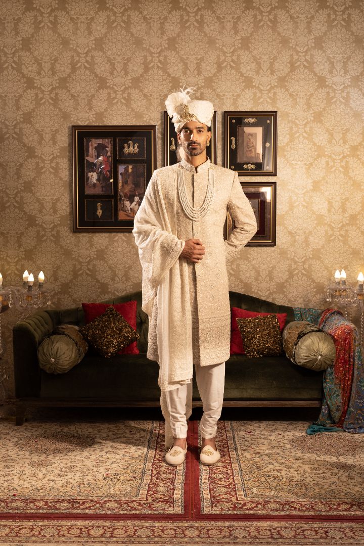 Beige Sherwami for groom with mala and stole