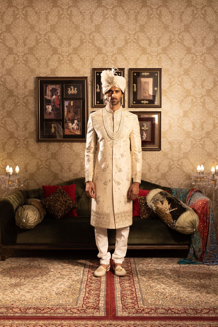 Ivory men’s silk sherwani with peacock motifs