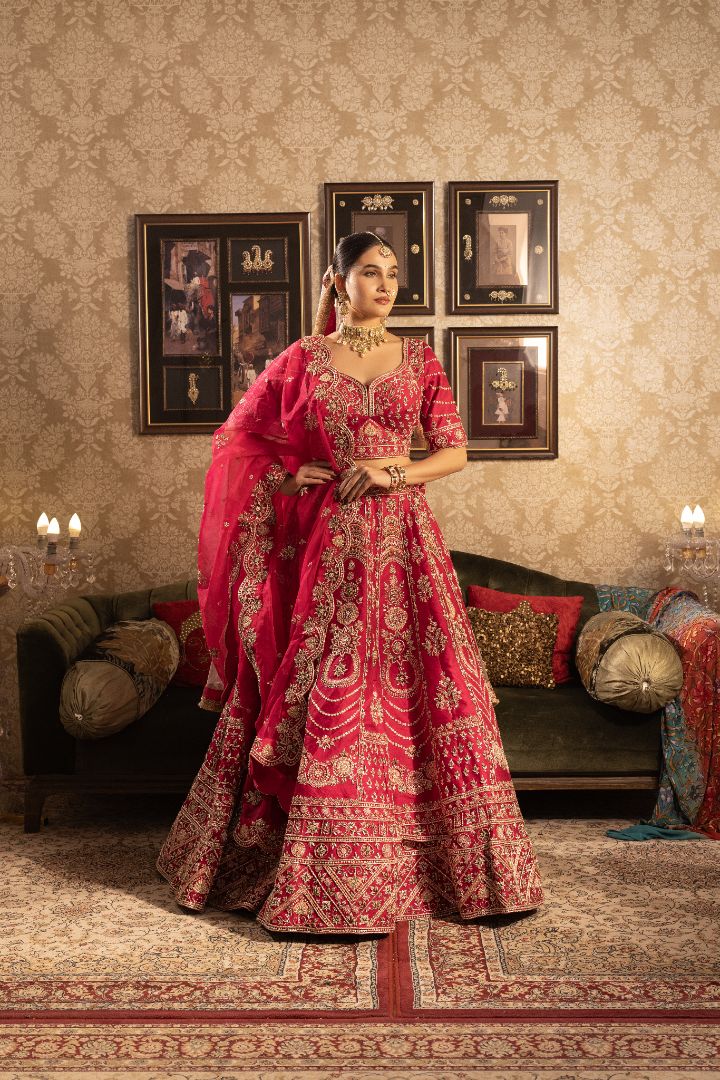 Red silk bridal lehenga with beads and cutdana embellishments