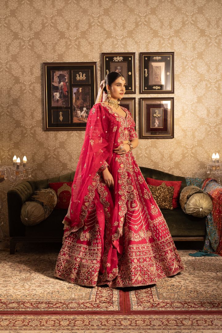 Red silk bridal lehenga with beads and cutdana embellishments