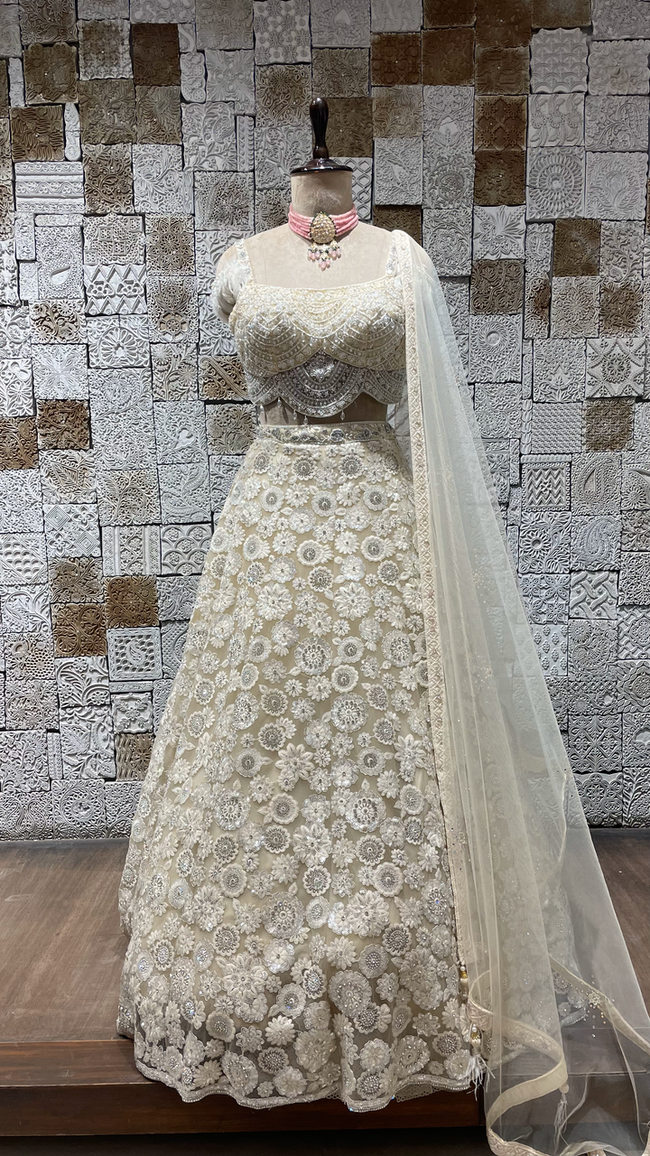 Ivory handwork embellished lehenga with cutdana and heavy latkans