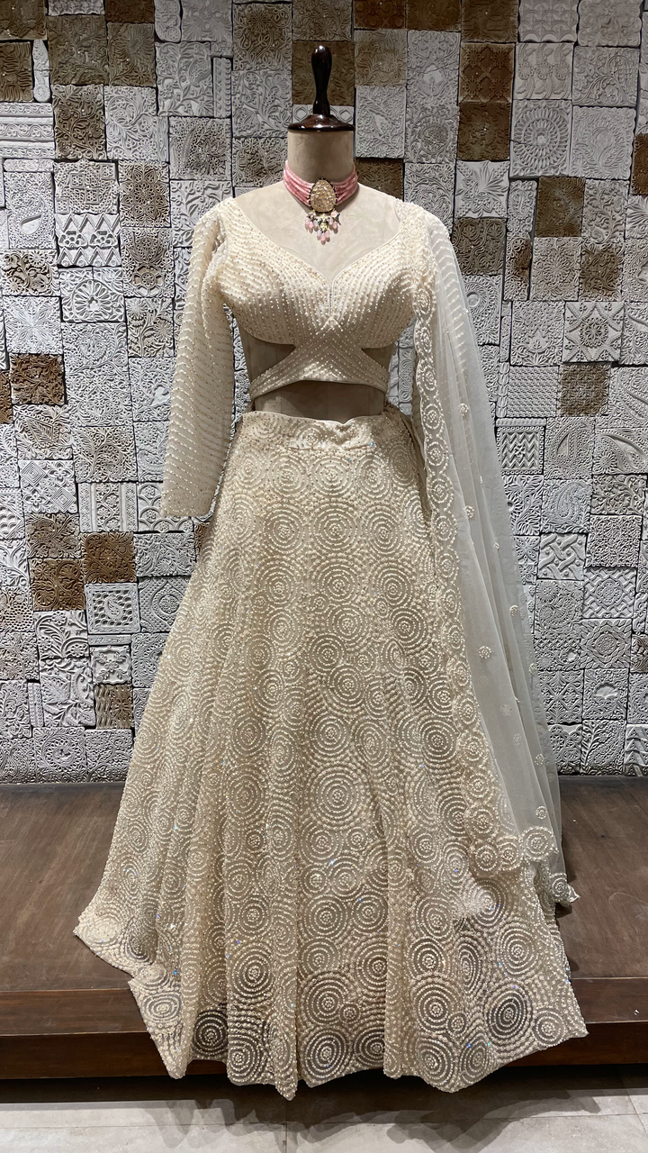 Ivory Net Lehenga with heavy Scallop Blouse and sequins embellishments