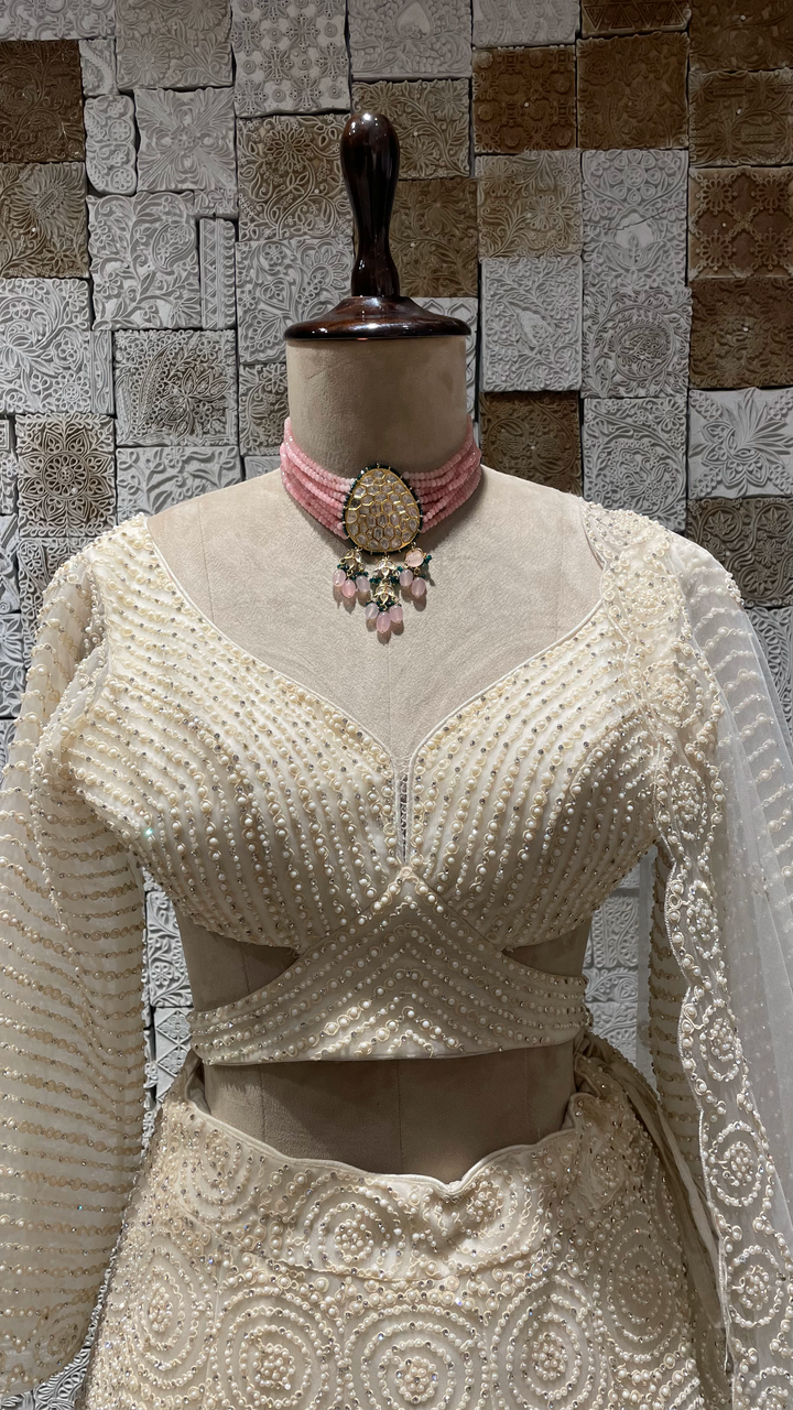 Ivory Net Lehenga with heavy Scallop Blouse and sequins embellishments
