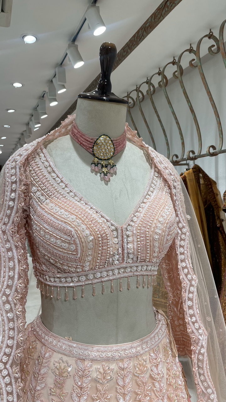 Pink Pastel lehenga with heavy embellished blouse and scallop dupatta