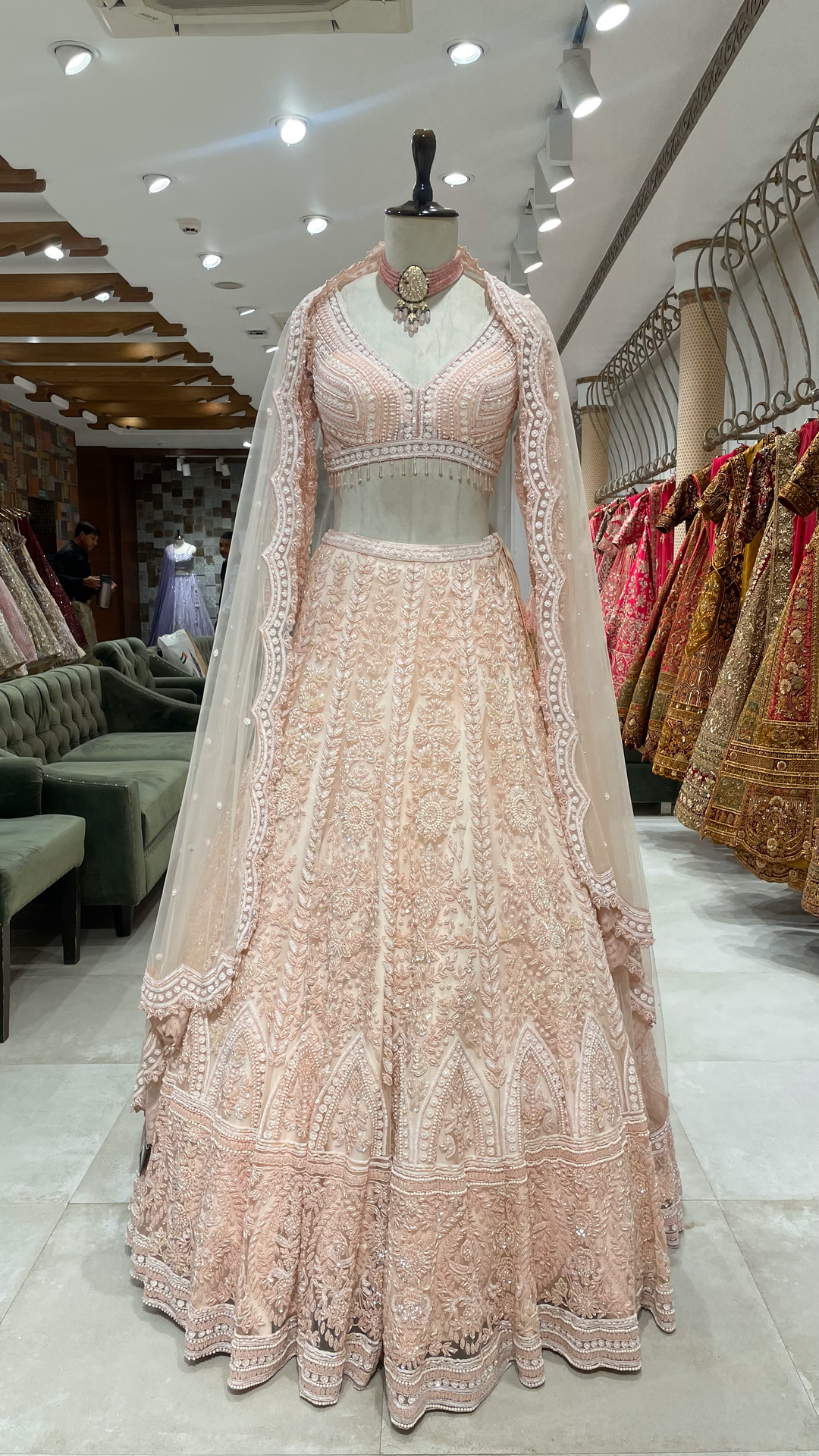 Pink Pastel lehenga with heavy embellished blouse and scallop dupatta