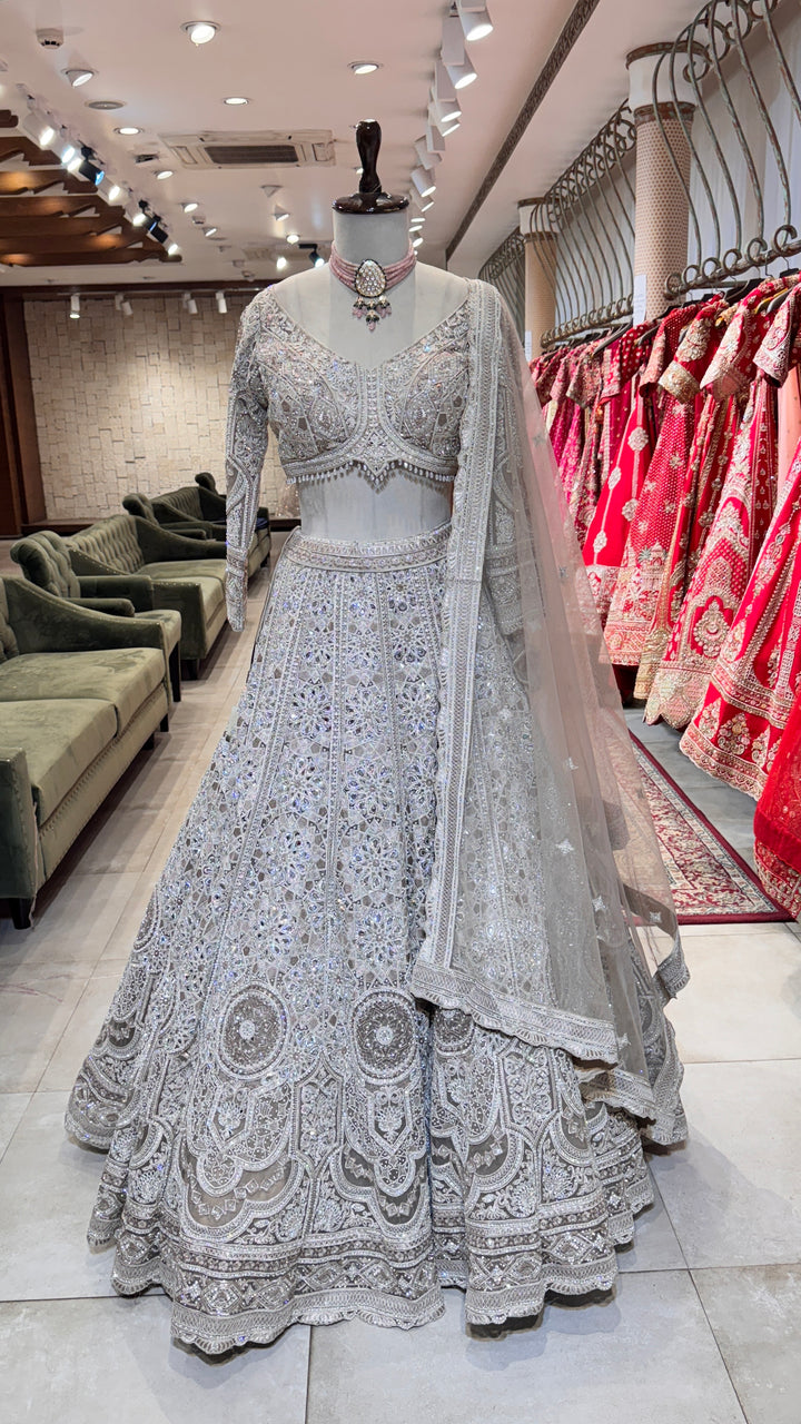 Silver lehenga with mirror and stonework