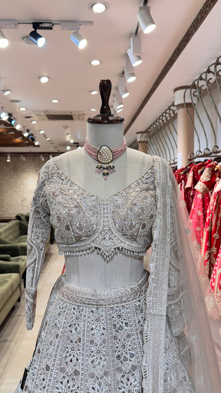 Silver lehenga with mirror and stonework