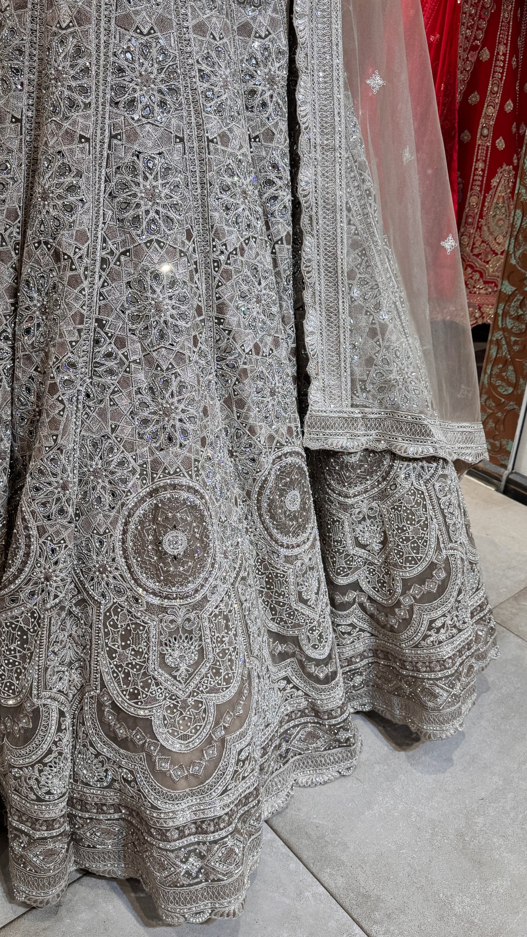 Silver lehenga with mirror and stonework