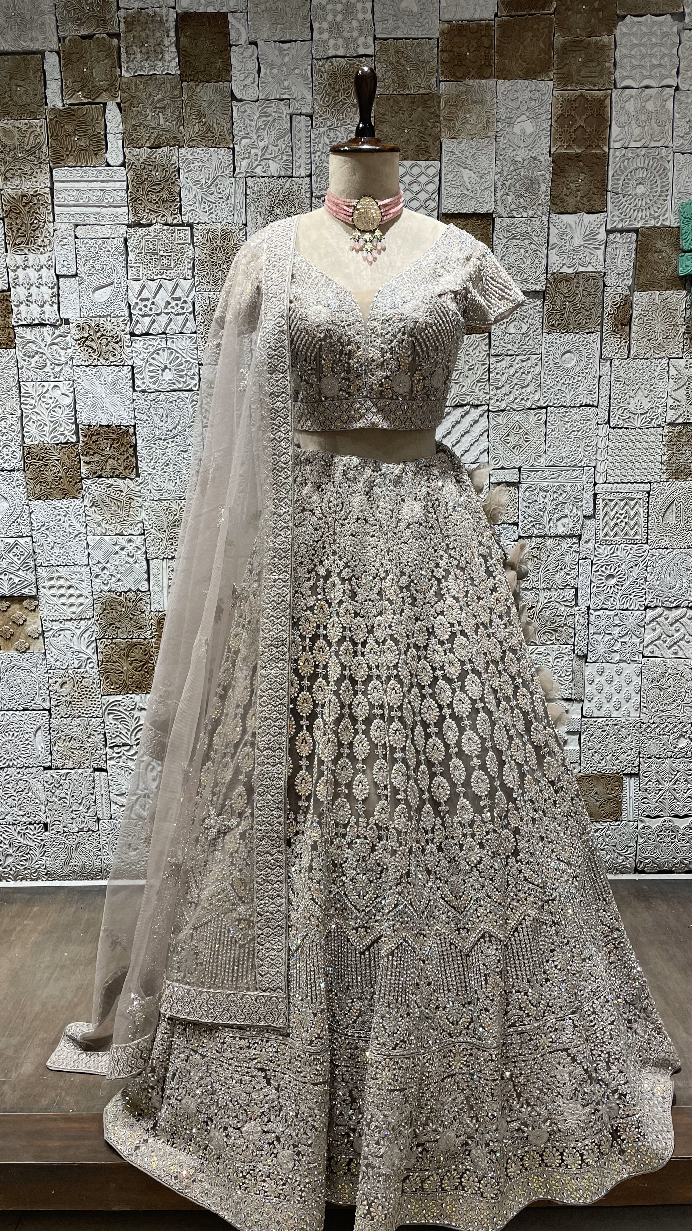 Beige mirrorwork lehenga on a net base