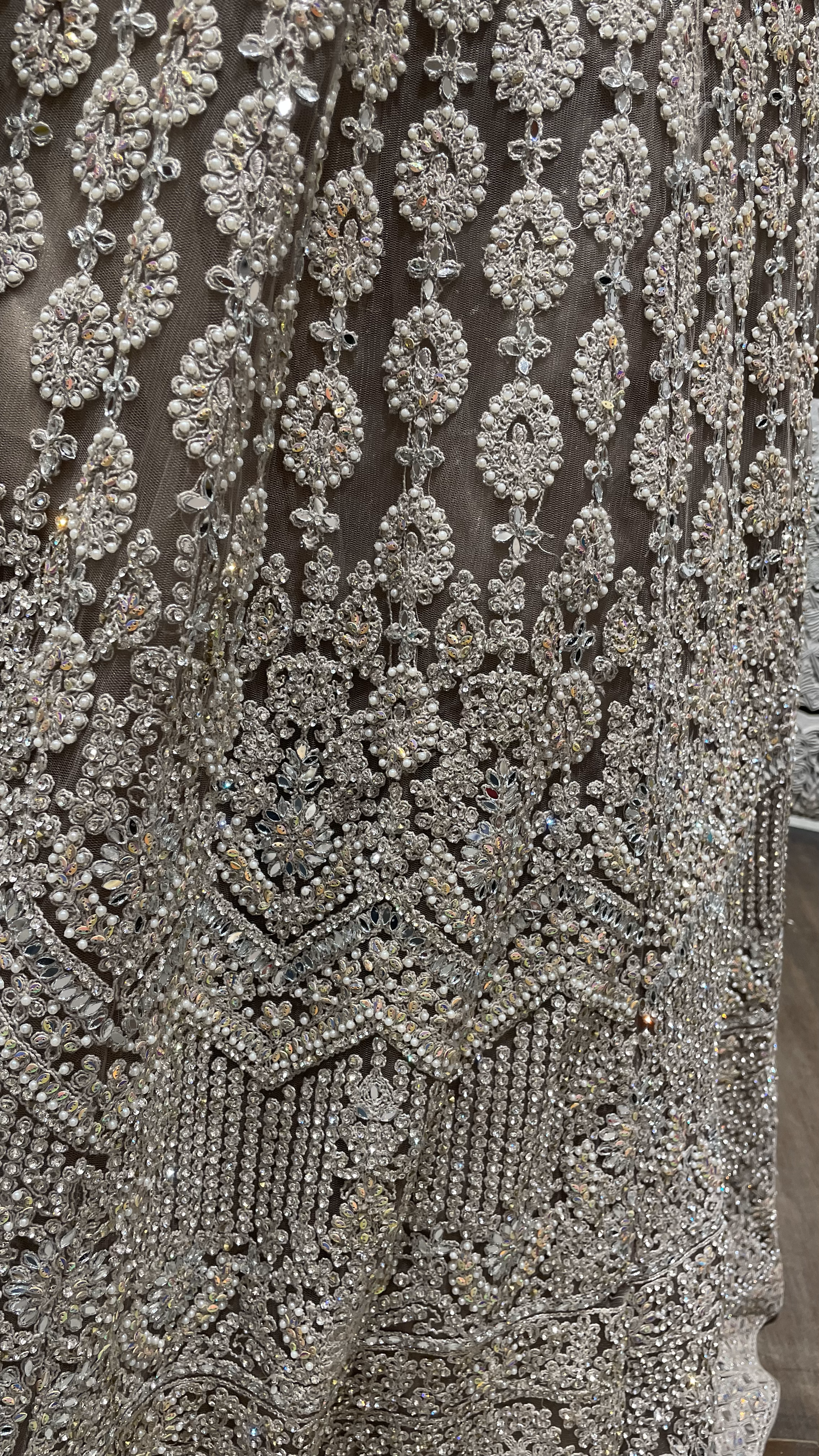 Beige mirrorwork lehenga on a net base