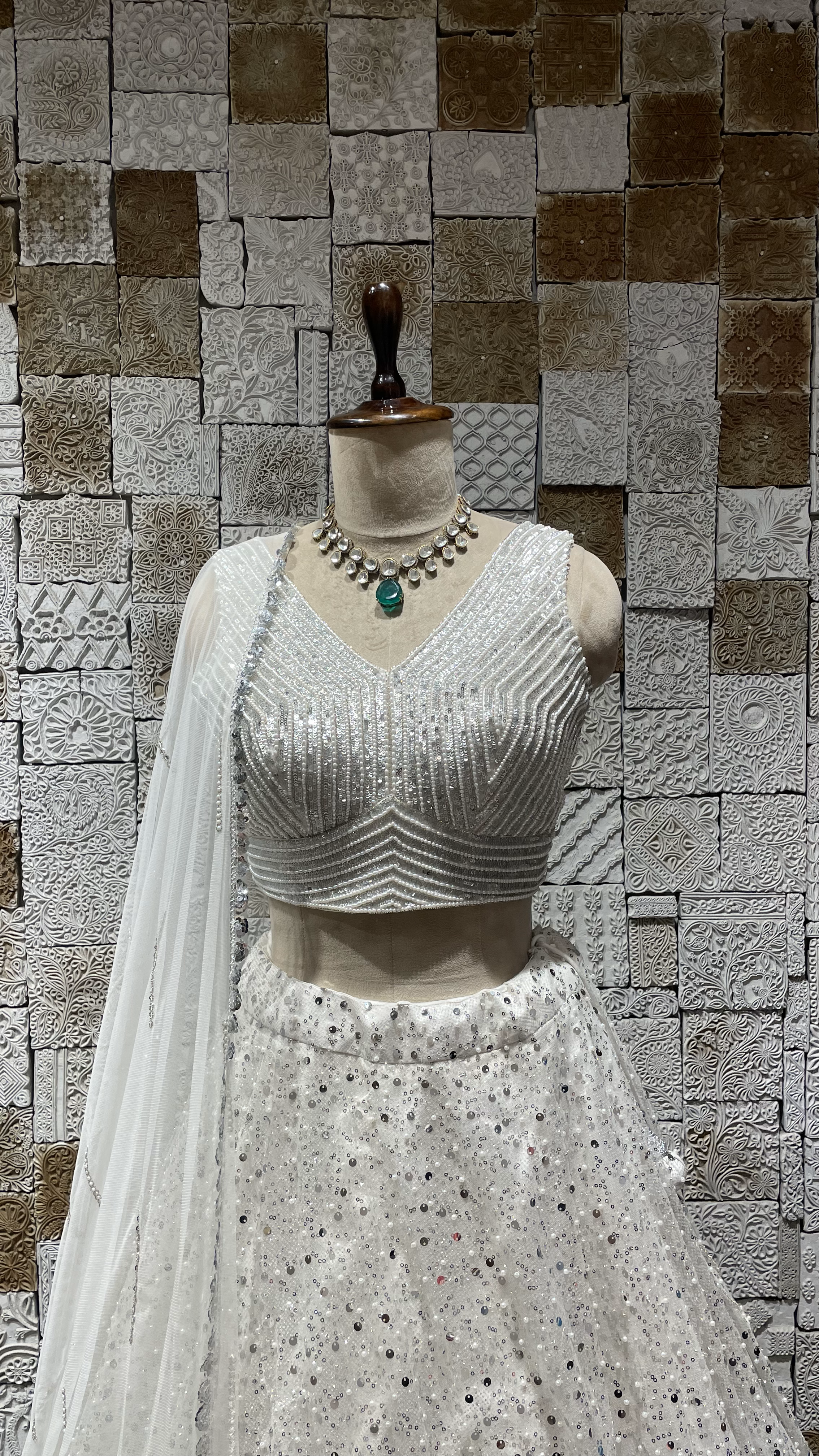 White Net lehenga with heavy embellished blouse