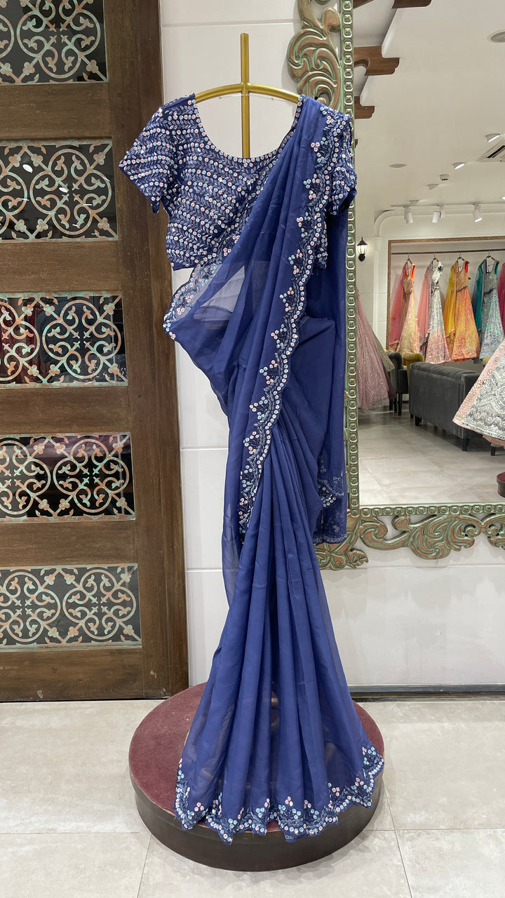 Blue organza saree with sequins embellishments