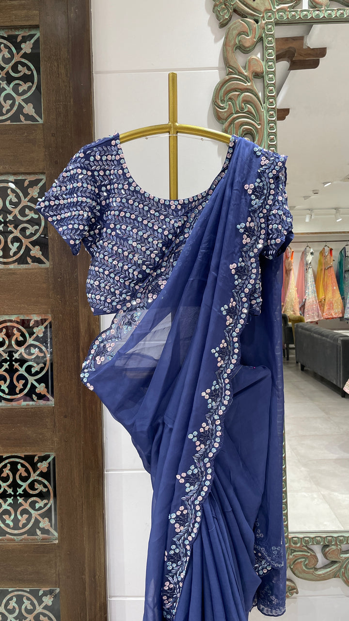 Blue organza saree with sequins embellishments