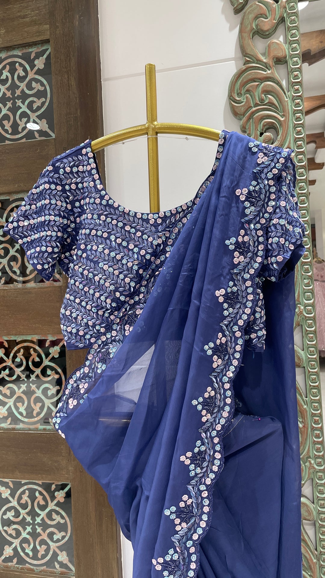 Blue organza saree with sequins embellishments