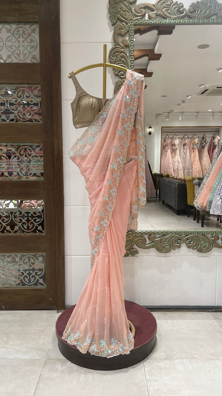 Pink organza saree with embellishments