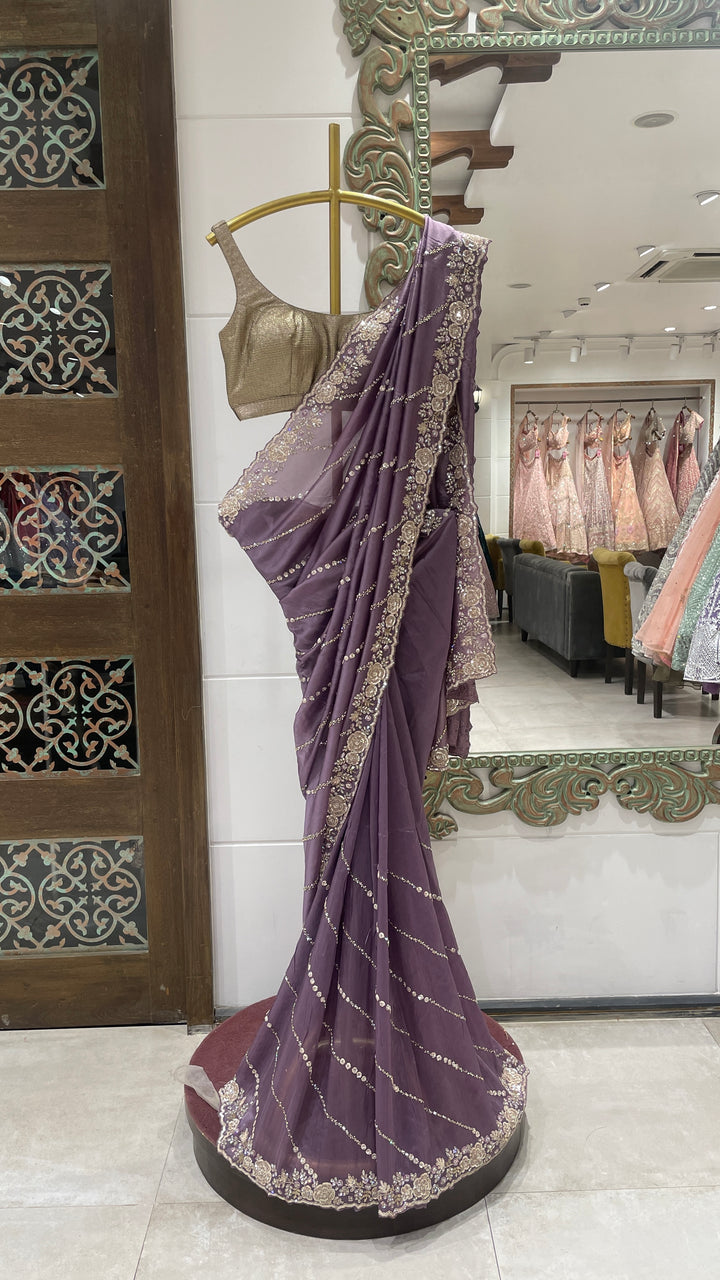 Purple organza saree with floral motifs