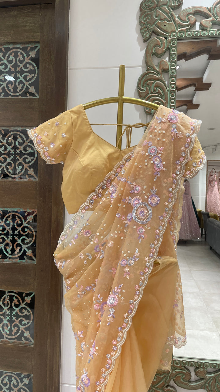 Yellow organza saree with multicolour sequins