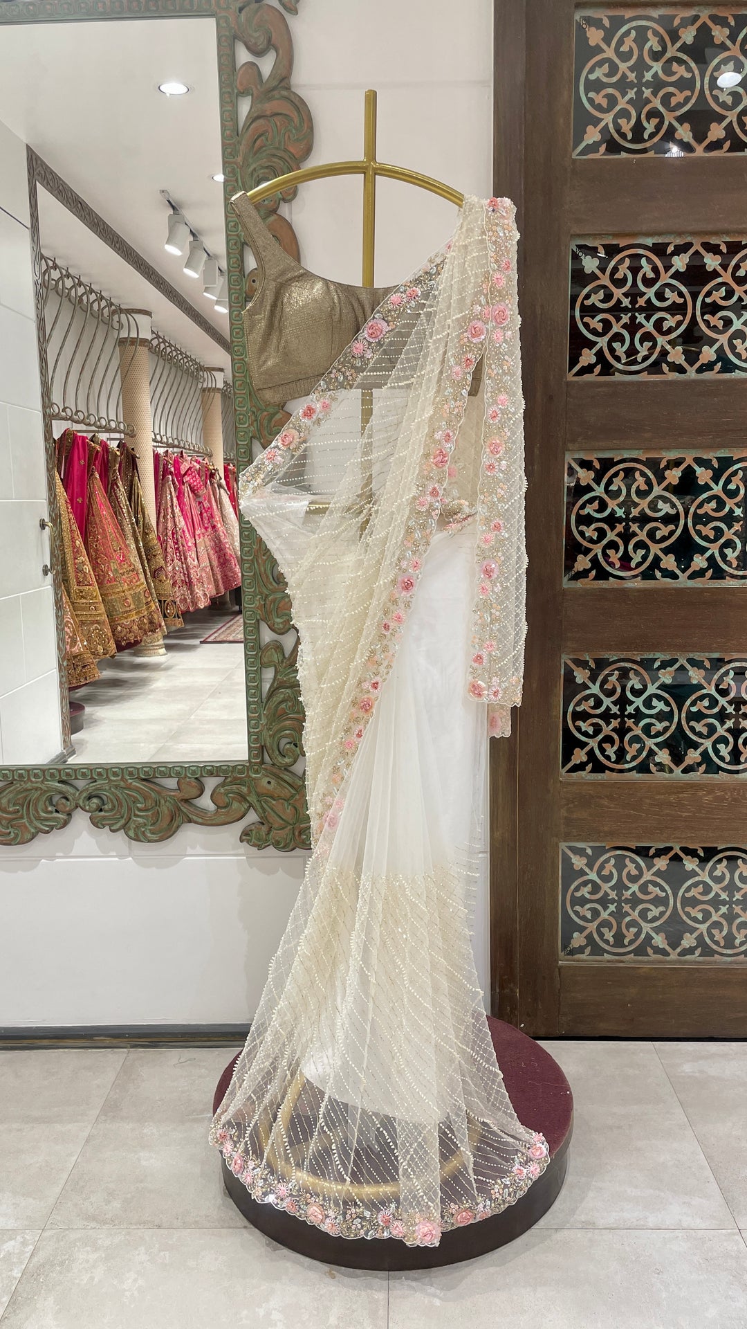 Ivory net saree with embellishments