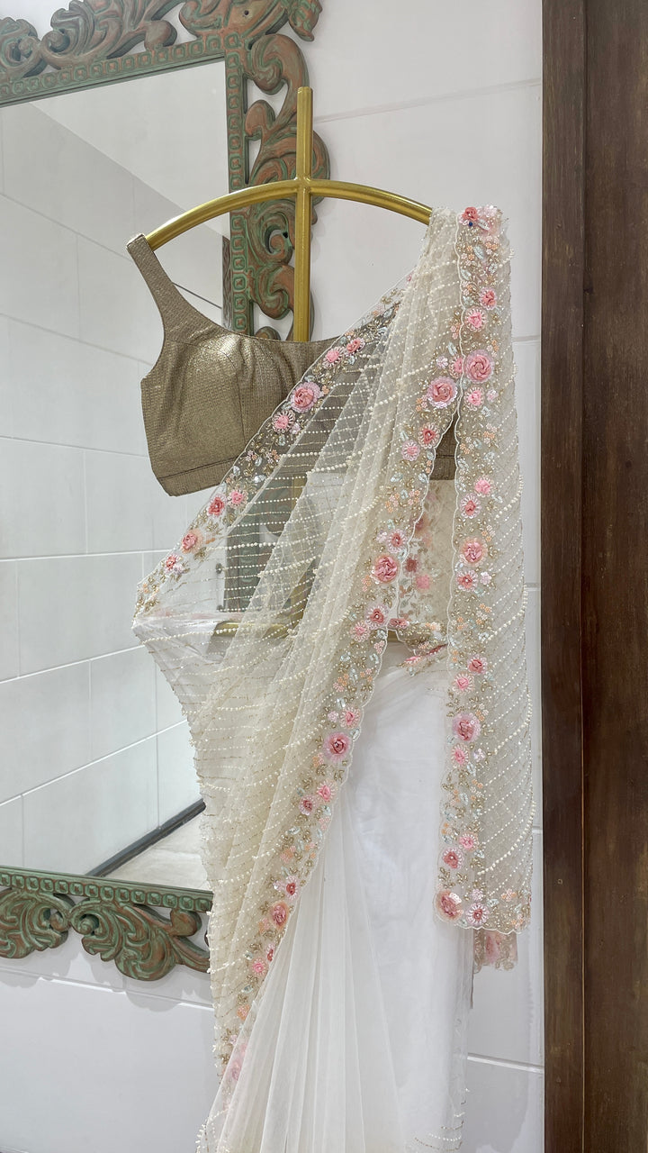 Ivory net saree with embellishments